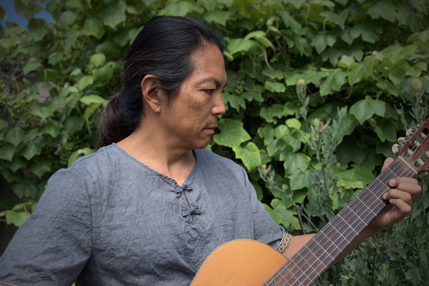 Musician Matt Yaki plays his guitar in a 2019 photo. (Photo provided)