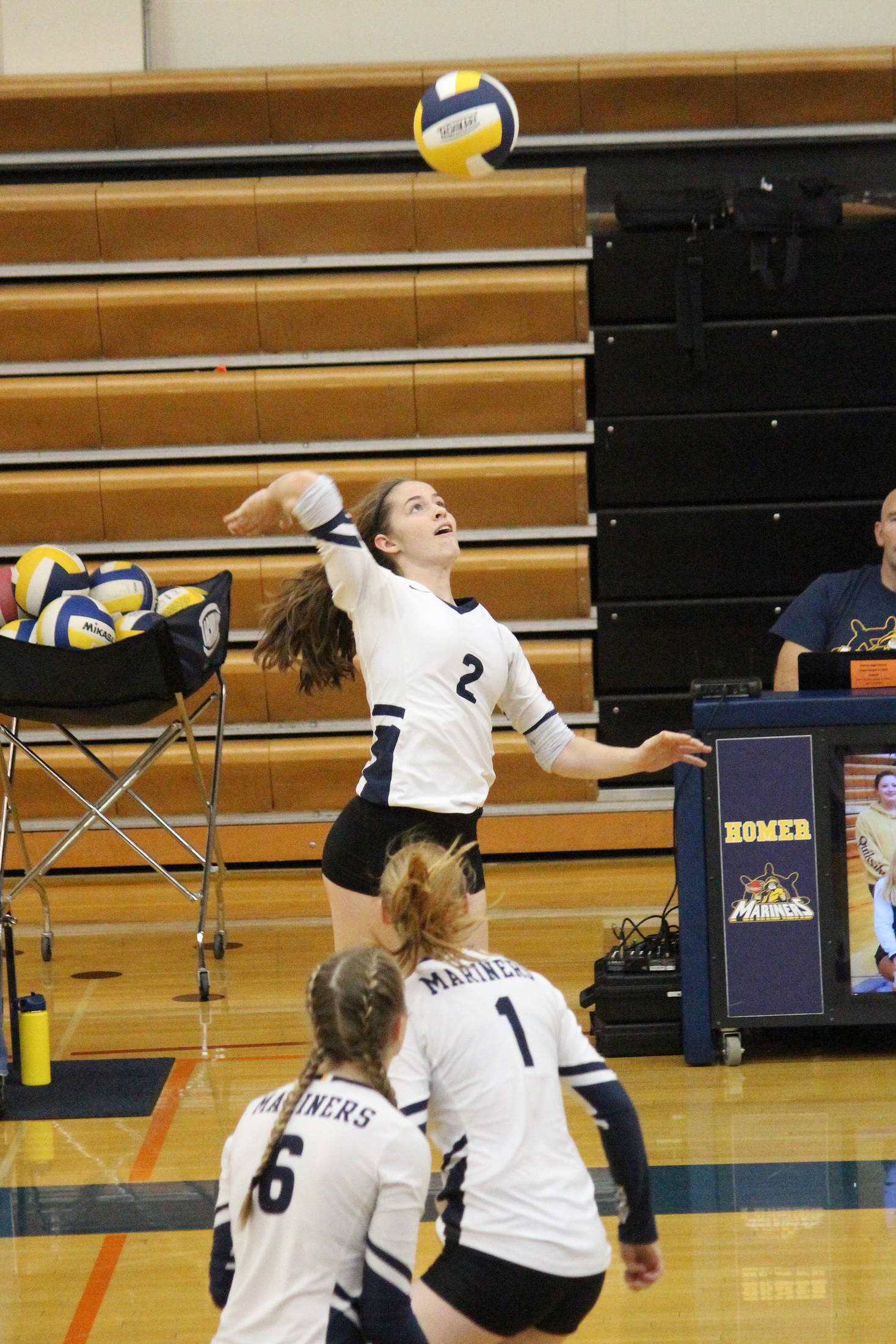 Homer’s Laura Inama jumps to spike the ball during a Saturday, Sept. 14, 2019 volleyball game against Nikiski at Homer High School in Homer, Alaska. (Photo by Megan Pacer/Homer News)