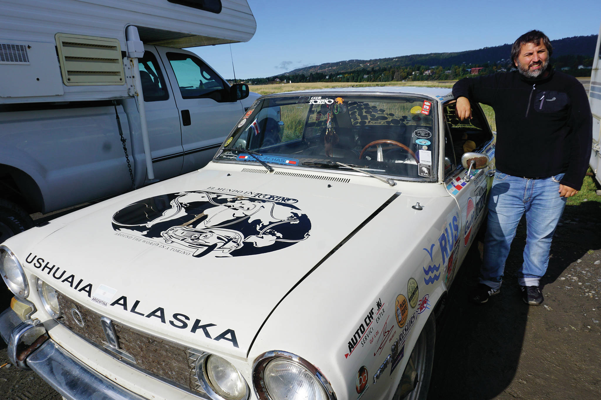 Héctor Argiró stands by his 1969 Torino at on Tuesday, Sept. 16, 2019, at Mariner Park on the Homer Spit in Homer, Alaska. Starting on Nov. 24, 2016, Argiró drove the Argentinian classic car from Buenos Aires to Ushuaia, Argentina, and north to Alaska through South America, Central America, Mexico, the western United States, and Canada. He plans to continue his trip through North America and then to Europe. For more about El Mundo en Torino (“Around the world in a Torino”), visit www.elmundoentorino.com. (Photo by Michael Armstrong/Homer News)