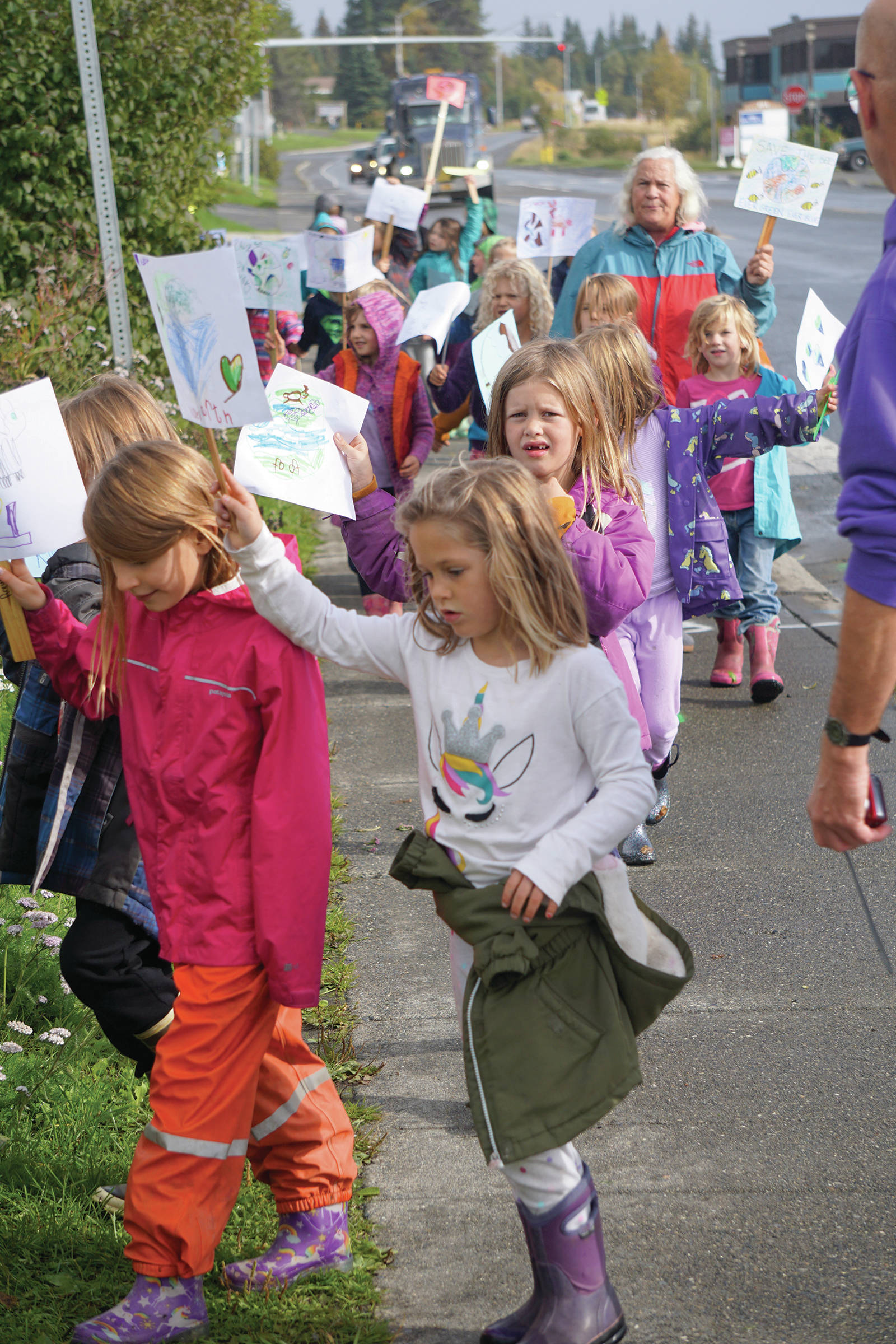 As part of their weekly Friday walks to local parks, Little Fireweed Academy students held a “We love the Earth March” to WKFL Park on Sept. 20, 2019, in Homer, Alaska. The kindergarten through second-grade students have been learning about ecology and animals and their connection to the earth. The march wasn’t associated with the Strike for the Climate held the same day. (Photo by Michael Armstrong/Homer News)