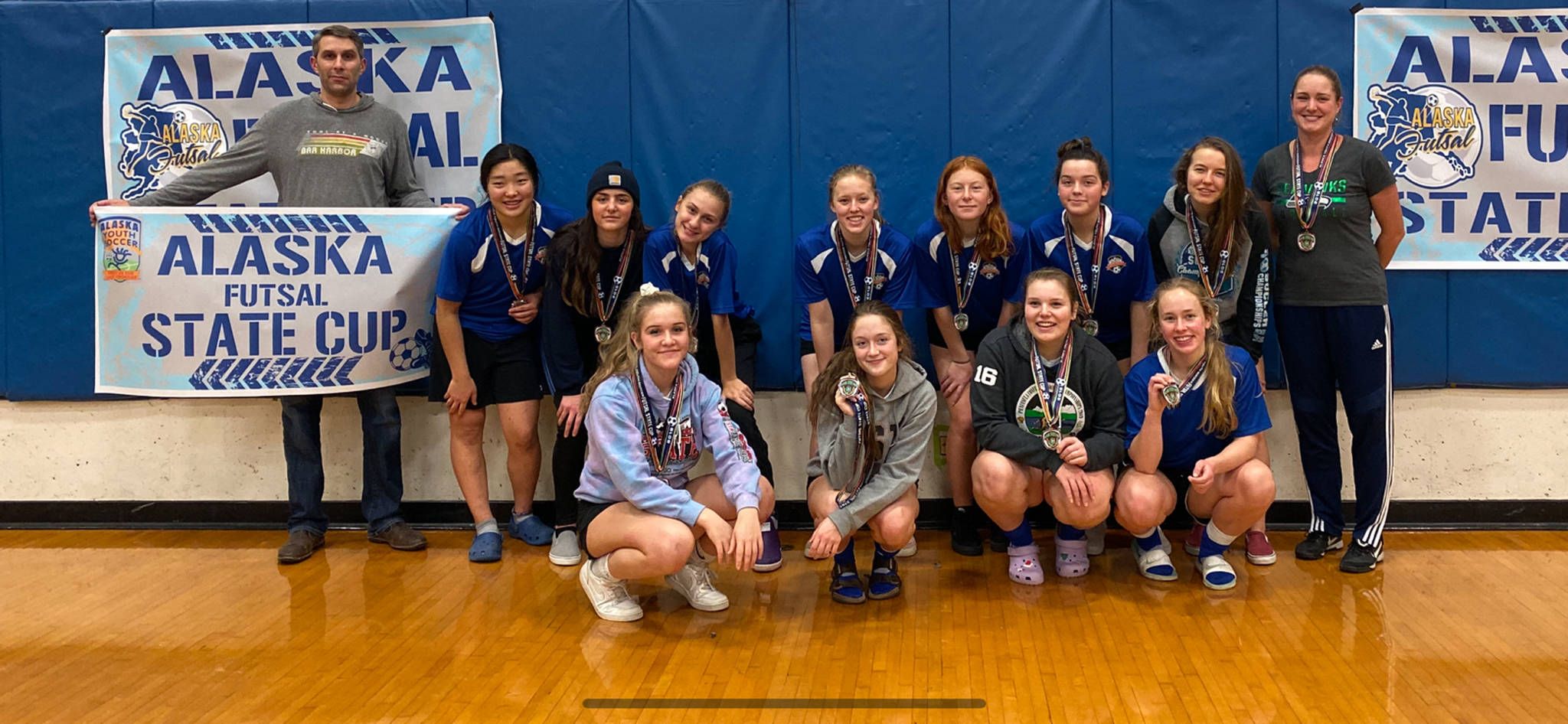 Members of the Bayview United under 16/under 19 girls team with the Soccer Association of Homer, celebrate winning second place at the 2019 Alaska Youth Soccer Futsal State Cup in Anchorage, Alaska. (Photo courtesy Breanna Hill)