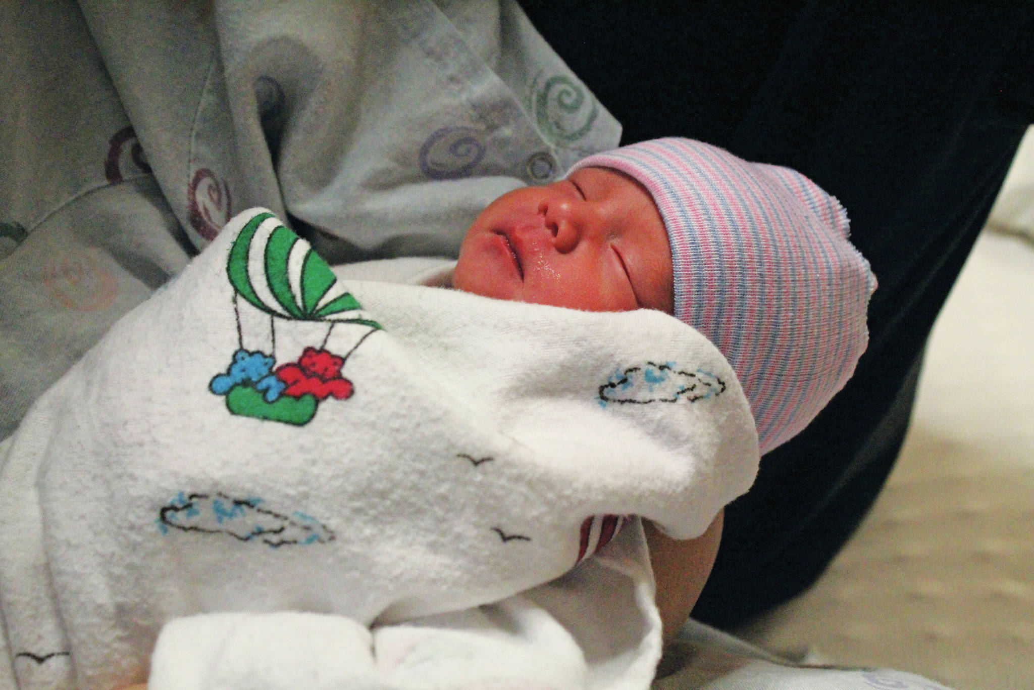 Ariyana Carlson rests in her mother’s arms Friday, Jan. 3, 2020 in the birthing center at South Peninsula Hospital in Homer, Alaska. Carlson was the first baby born in Homer in the new year. (Photo by Megan Pacer/Homer News)