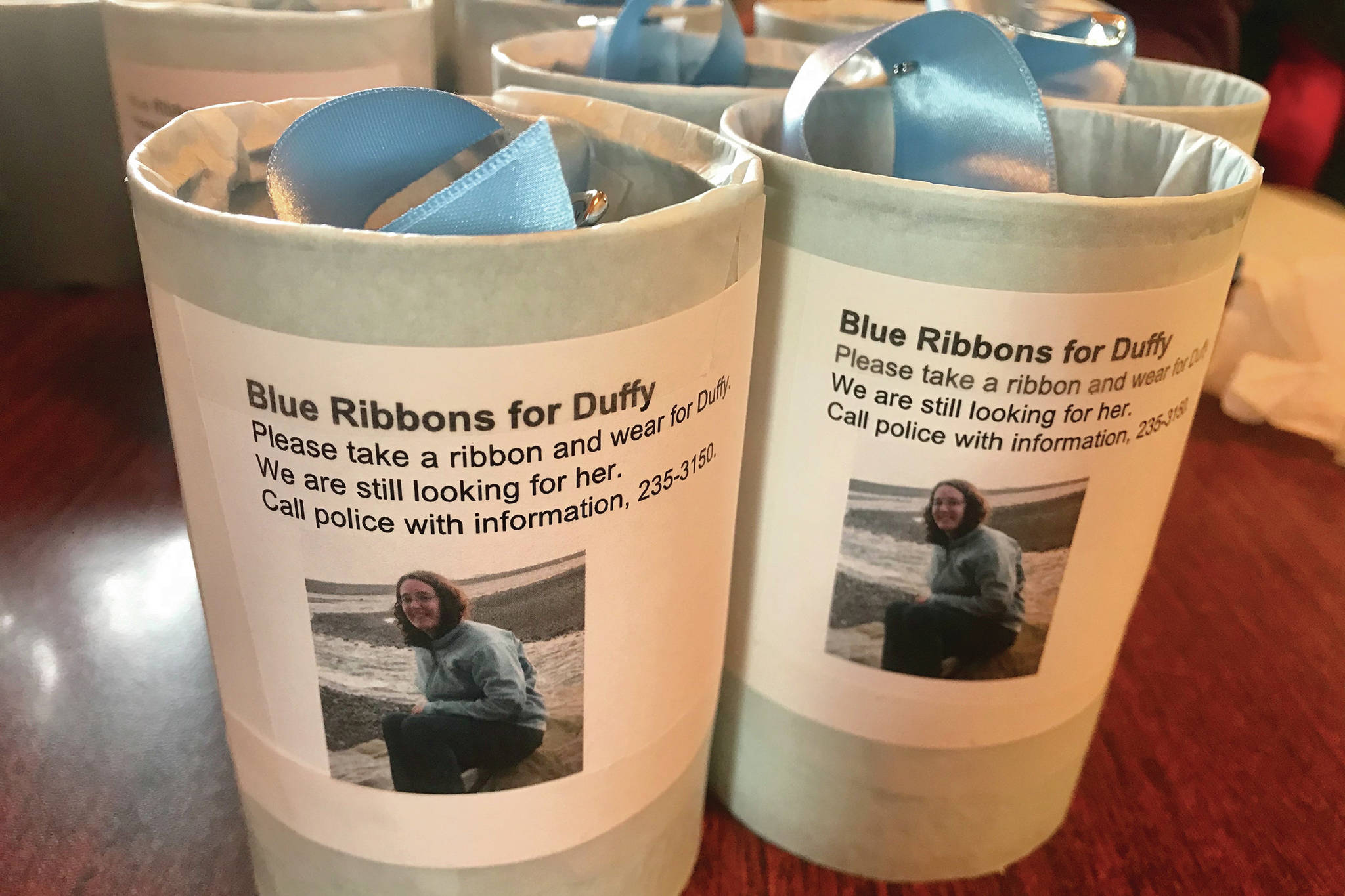 Blue ribbons put out for missing Homer woman