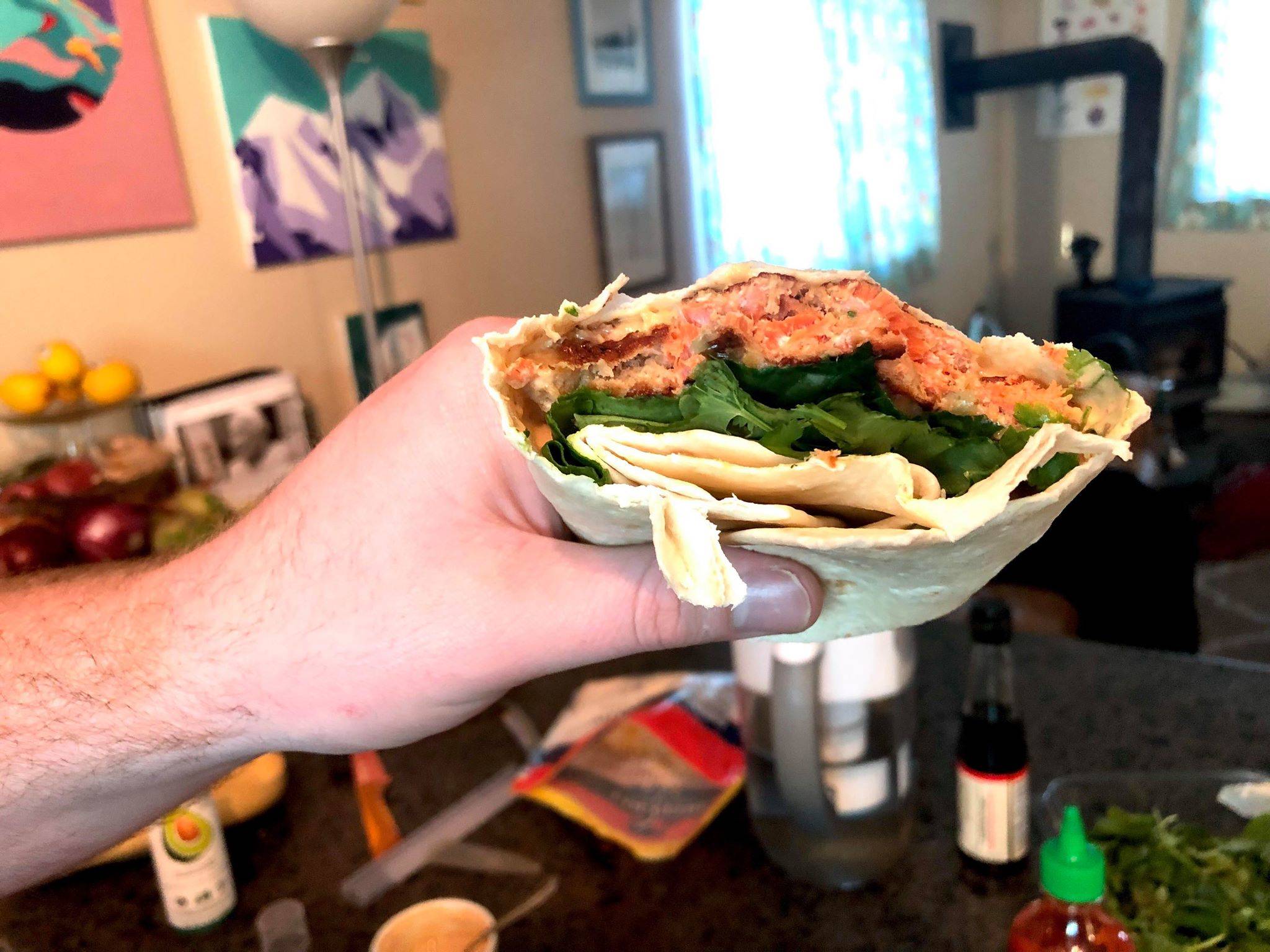 Salmon, greens, an assortment of spices and condiments make a salmon patty wrap. (Photo by Victoria Petersen/Peninsula Clarion)