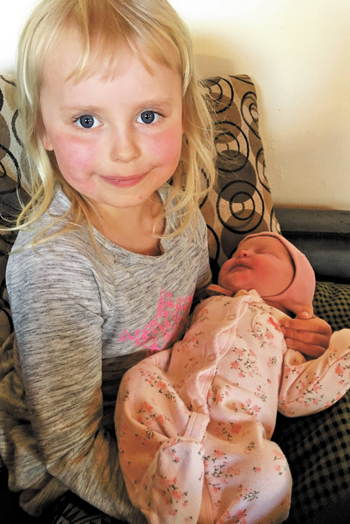 Big sister Violet Sullivan holds her new baby sister, Frances “Frankie” Eleanor Sullivan, born to Tessa and Mike Sullivan on April 17, 2020 in Homer, Alaska. (Photo courtesy Tessa Sullivan)