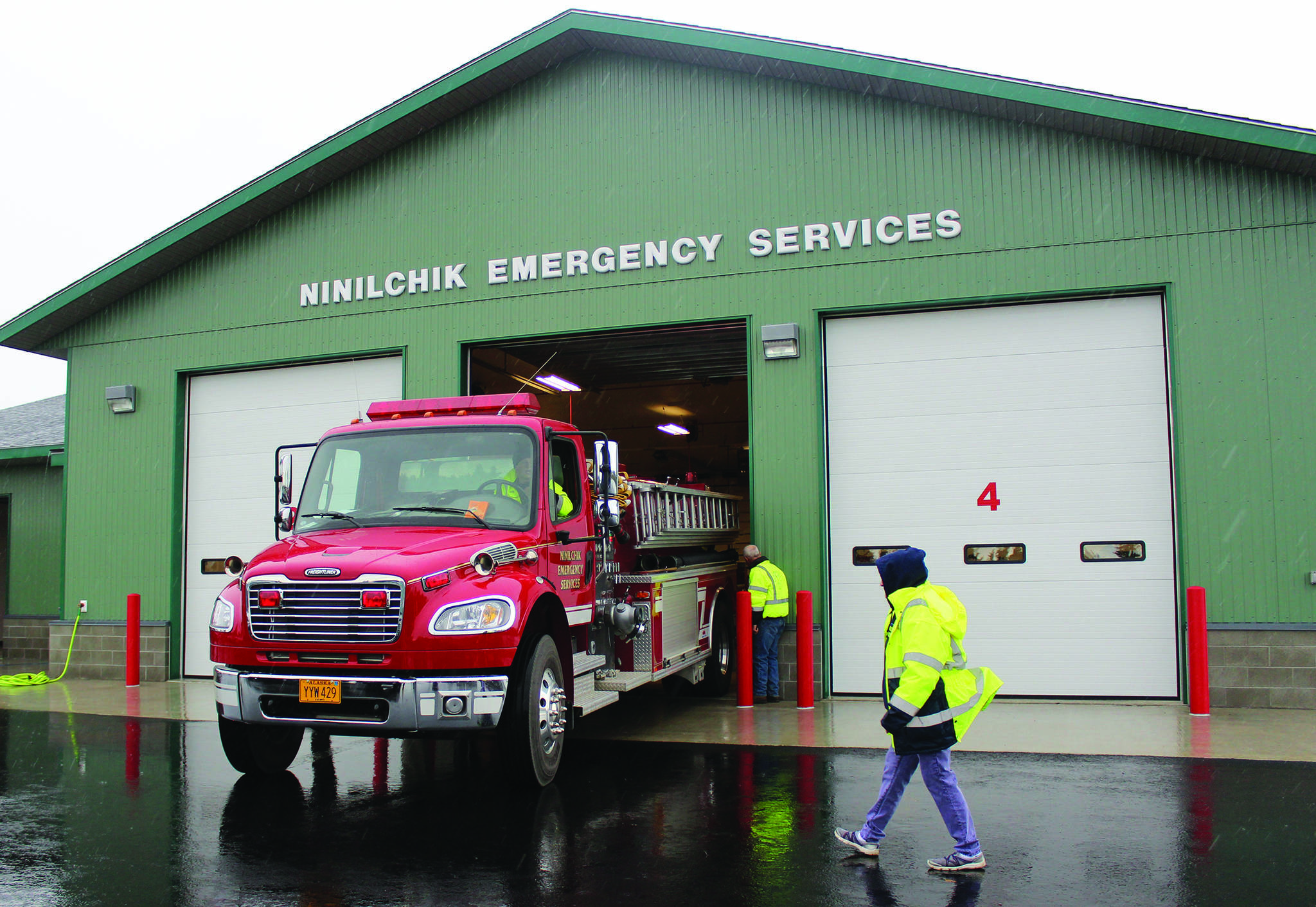 Ninilchik Fire Chief David Bear moves the fire truck out of the new Ninilchik Emergency Services building on Aug. 9, 2014, to make room for visitors to the open house of the new NES building. (Homer News file photo)                                Ninilchik Fire Chief David Bear moves the fire truck out of the new Ninilchik Emergency Services building on Aug. 9, 2014, to make room for visitors to the open house of the new NES building. (Homer News file photo)
