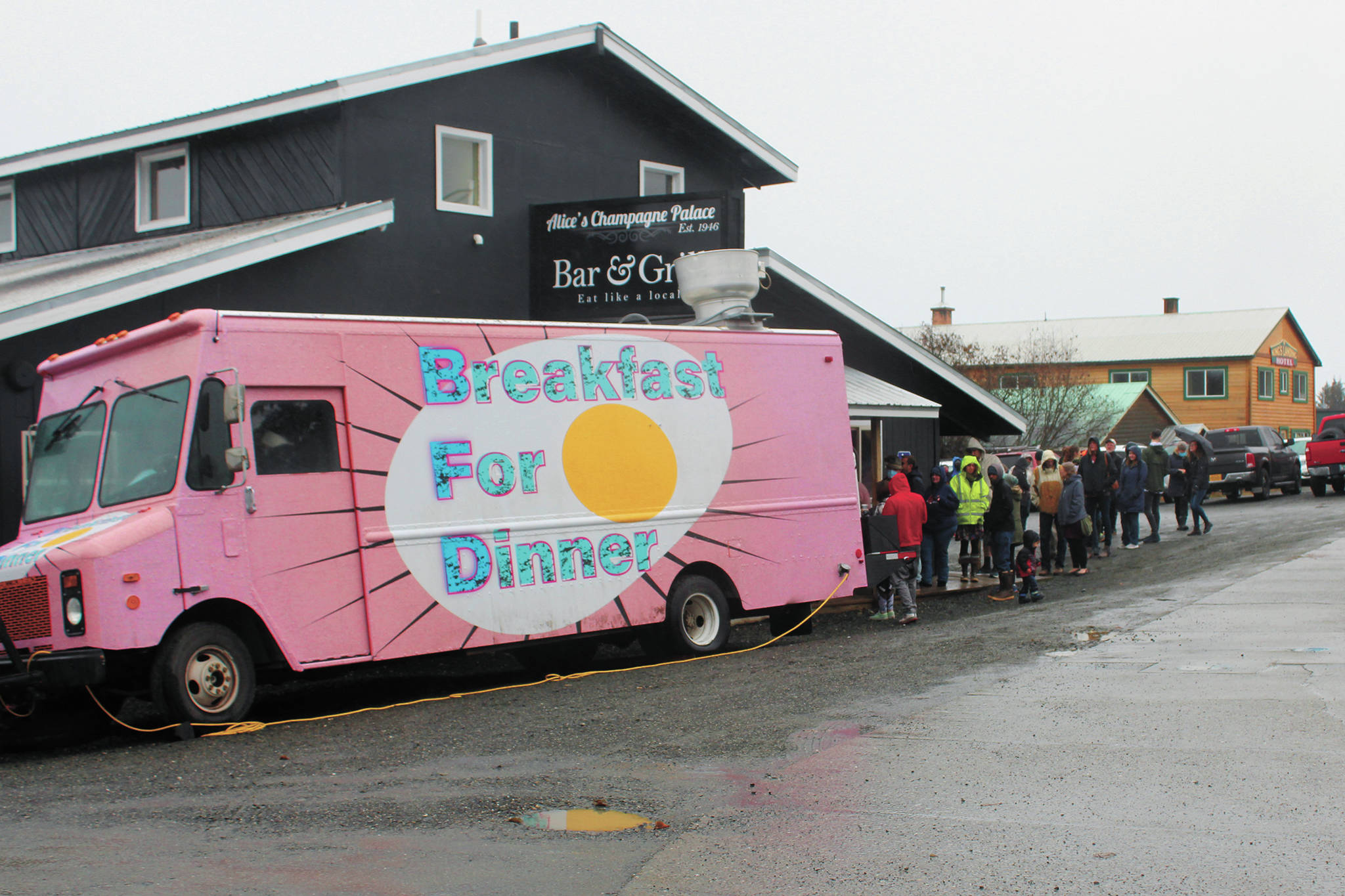 Locals wait in line to eat from the BFDfoodtruck (breakfast for dinner) on Sunday, Nov. 8, 2020 at Alice's Champagne Palace in Homer, Alaska. The food truck was in town along with four others as part of the Food Network show "The Great Food Truck Race." (Photo by Megan Pacer/Homer News)