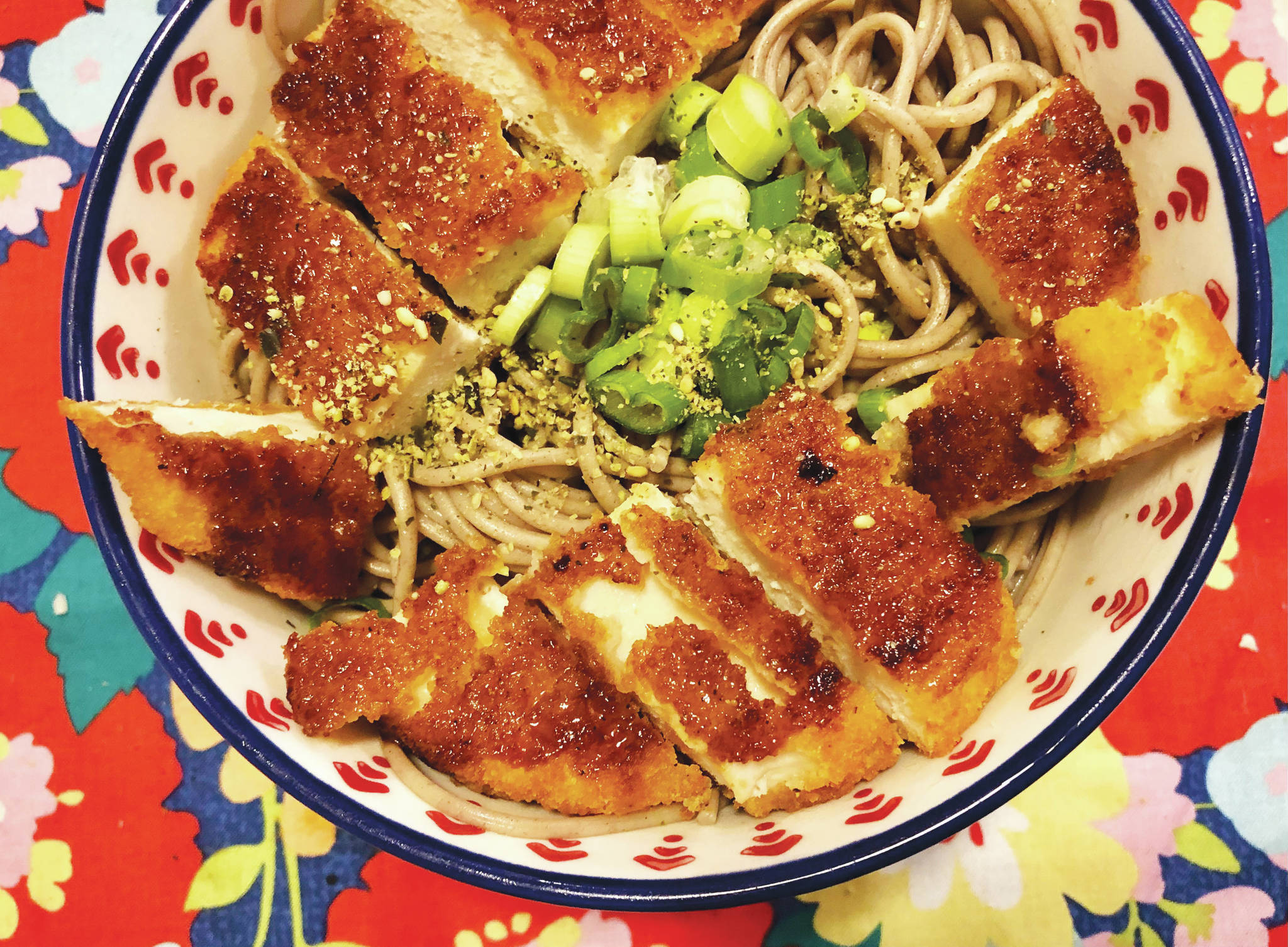 A chicken patty adds to a simple Japanese-cuisine-inspired noodle bowl, Jan. 15, 2021, in Anchorage, Alaska. (Photo by Victoria Petersen/Peninsula Clarion)