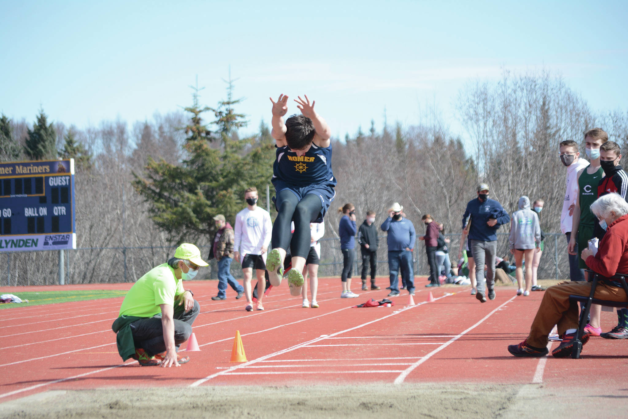 Homer High School Mariner Ryan Carroll competes in the long jump on Saturday, April 24, 2021, at Homer High School in Homer, Alaska. (Photo by Michael Armstrong/Homer News)