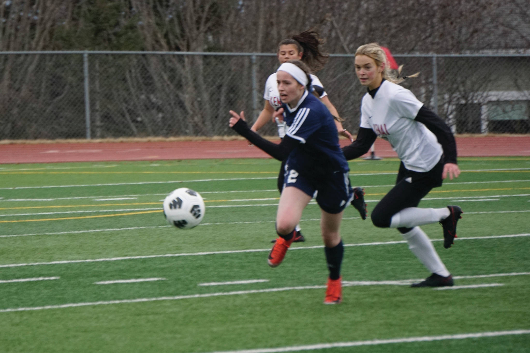 Lady Mariner Laura Inama, striker, moves the ball toward the Kenai Kardinals' goal on Thursday, April 22, 2021, at the Homer High School field in Homer, Alaska. (Photo by Michael Armstrong/Homer News)