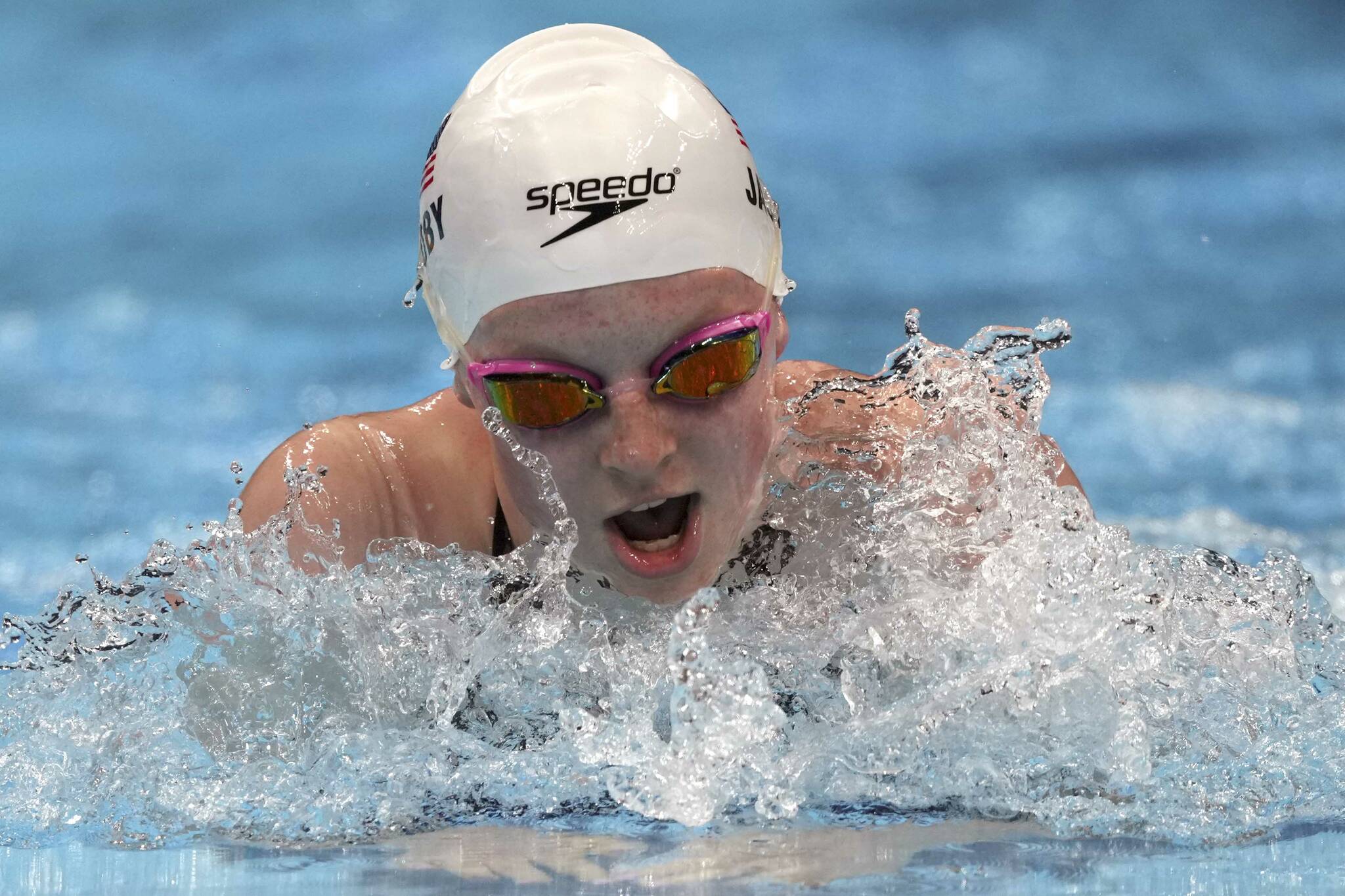 Lydia Jacoby of the United States swims in a heat during the women’s 100-meter breaststroke at the 2020 Summer Olympics, Sunday, July 25, 2021, in Tokyo, Japan. (AP Photo/Matthias Schrader)