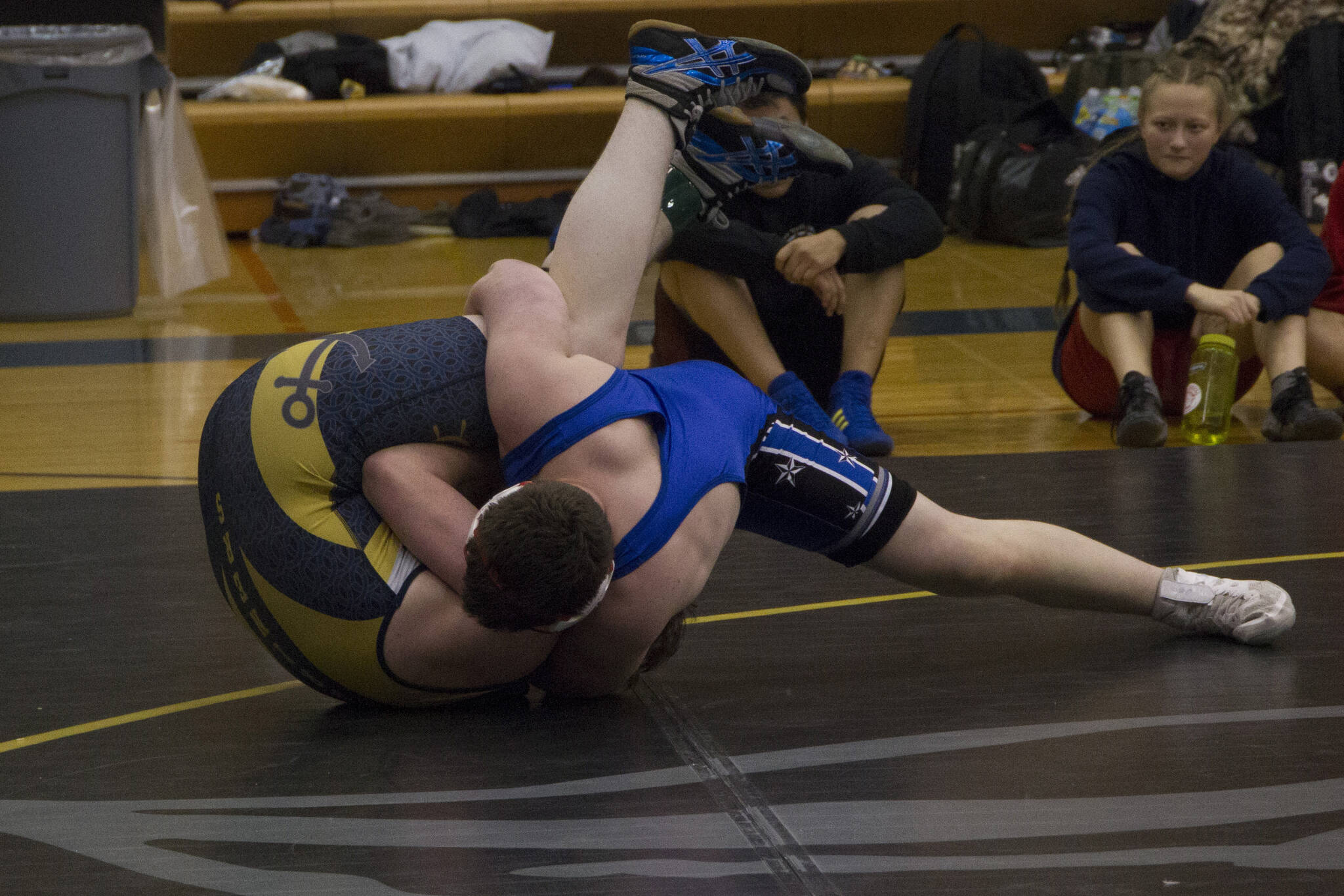 A Soldotna Stars wrestler goes for the pin against a Homer Mariners wrestler during the Best Western Bidarka Round Robin Rumble on Friday and Saturday in Homer. (Photo by Sarah Knapp/Homer News)