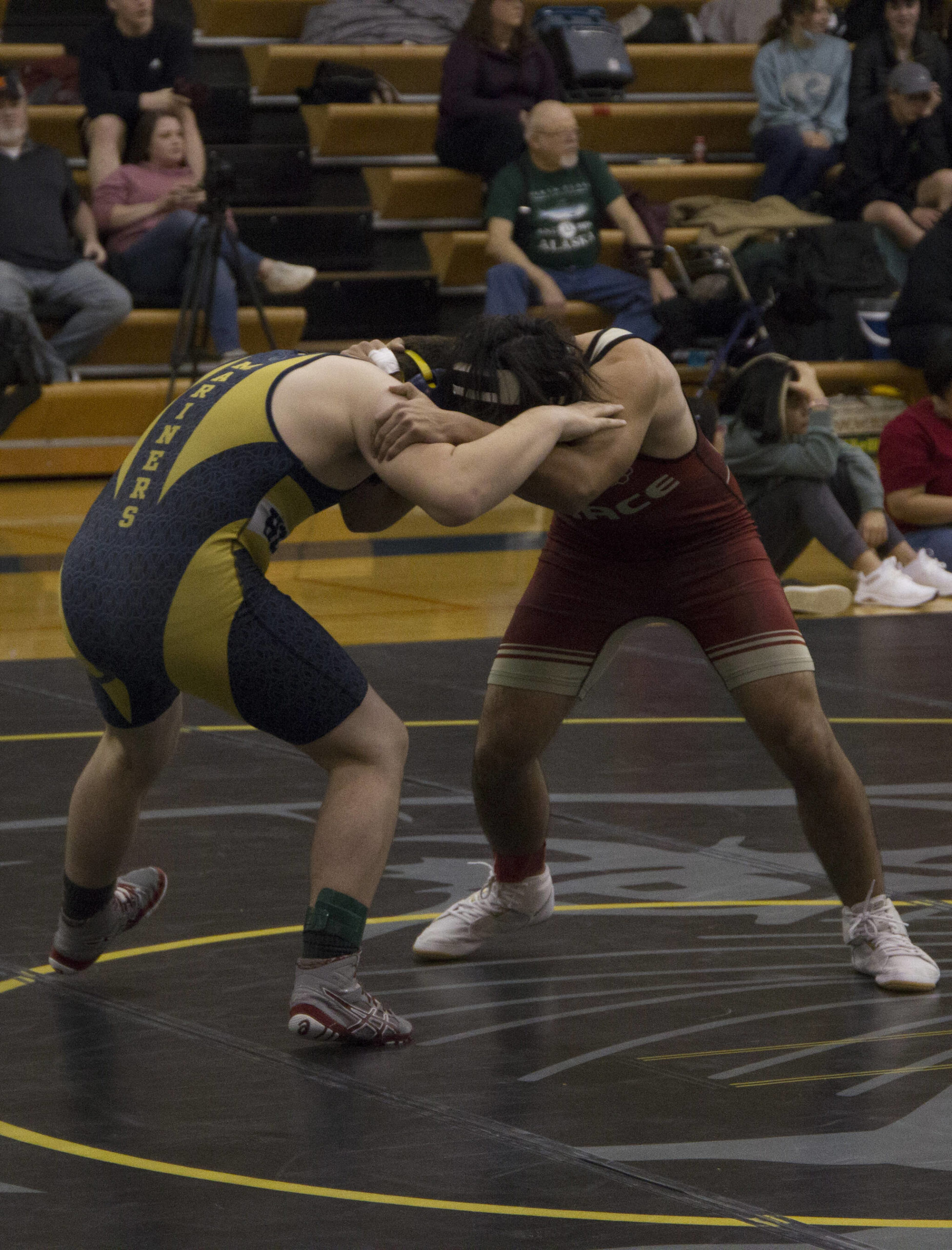 A Mariners wrestler faces off against a Grace Christian wrestler during the Best Western Bidarka Round Robin Rumble on Friday and Saturday in Homer. (Photo by Sarah Knapp/Homer News)