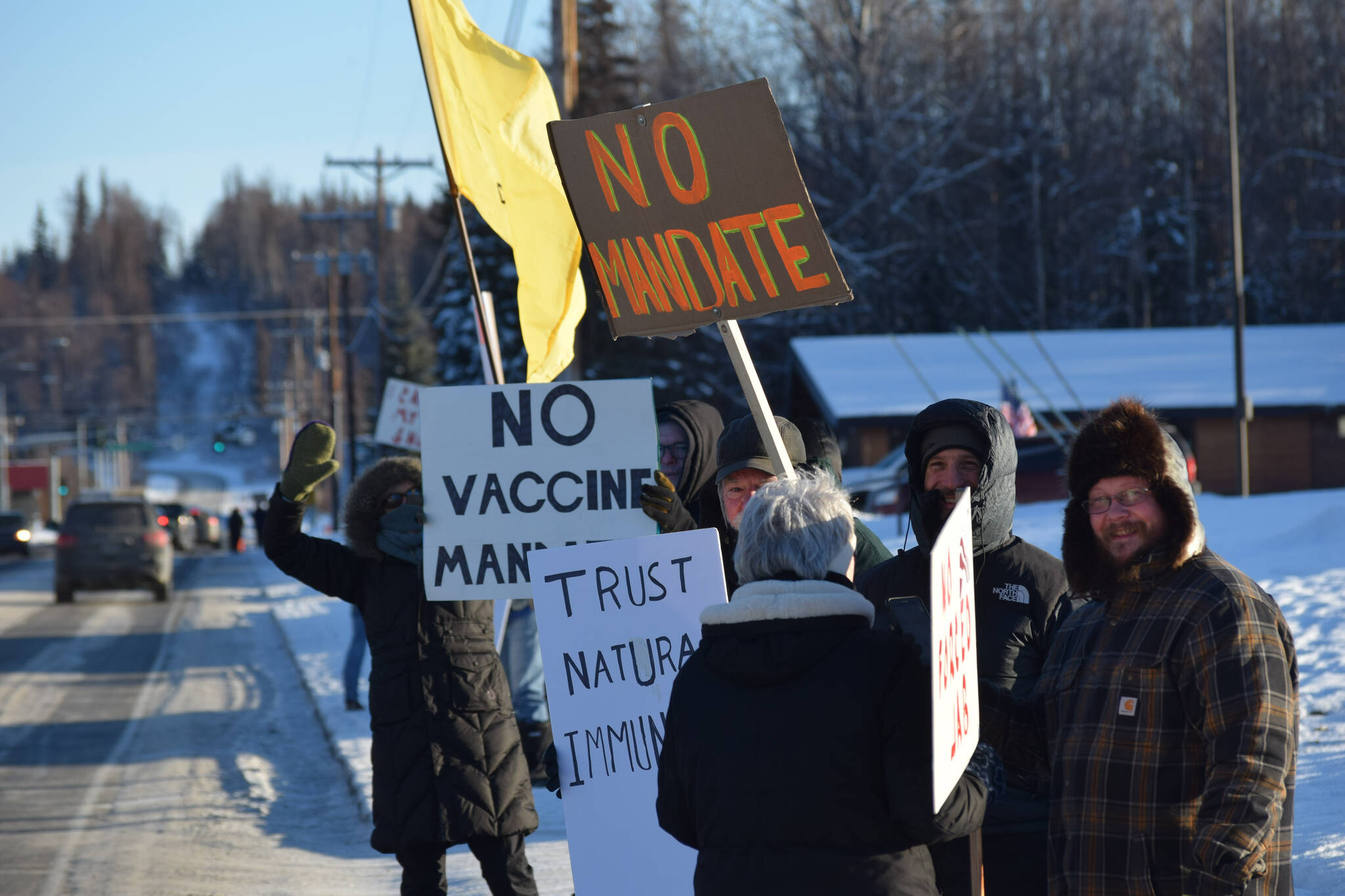 Demonstrators gather outside of Central Peninsula Hospital in Soldotna to protest COVID-19 vaccine mandates and advocate for alternative treatments on Saturday, Nov. 20, 2021. (Camille Botello/Peninsula Clarion)