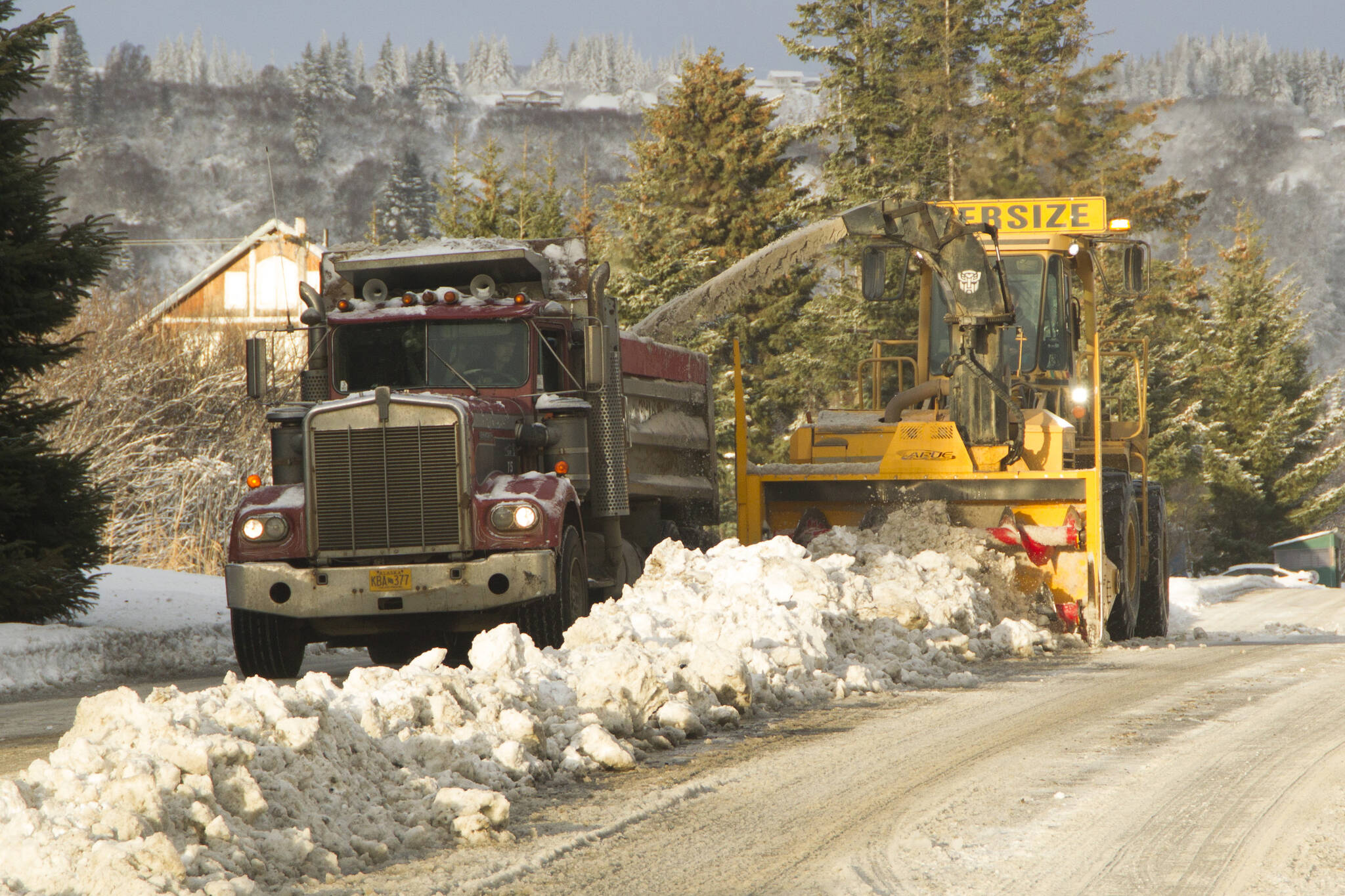 Snow on Heath Street is blown into a truck, which will later be dumped near Public Works. (Photo by Sarah Knapp/Homer News)