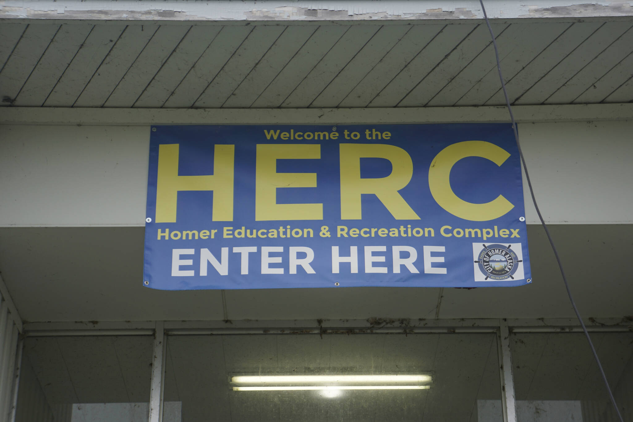 A sign hangs over the entrance to the Homer Education and Recreation Complex on Saturday, Oct. 2, 2021, in Homer, Alaska. (Photo by Michael Armstrong/Homer News)