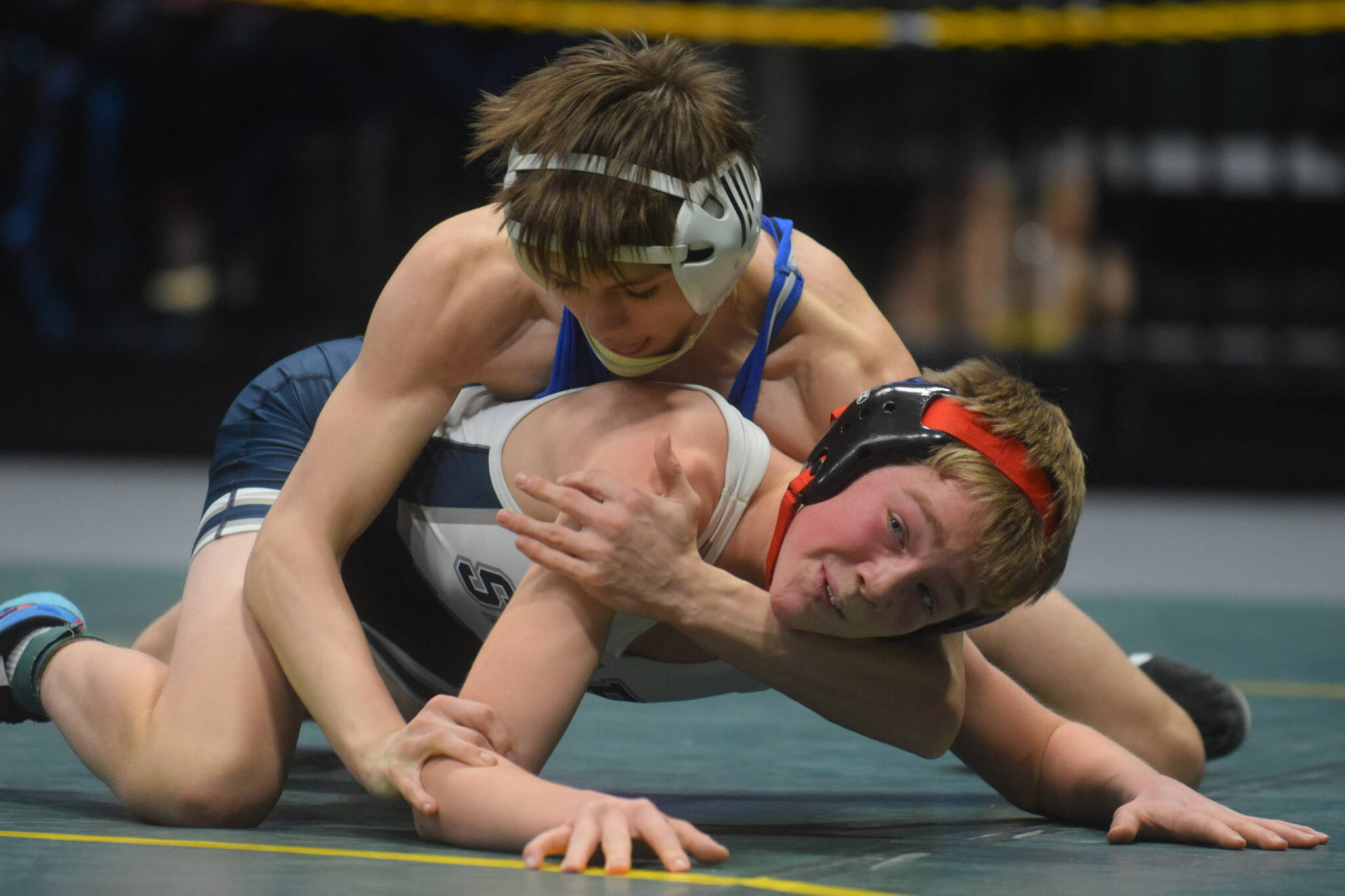 Soldotna’s Jacob Strausbaugh competes in the Division I state wrestling championship at the Alaska Airlines Center in Anchorage on Saturday, Dec. 18, 2021. (Camille Botello/Peninsula Clarion)