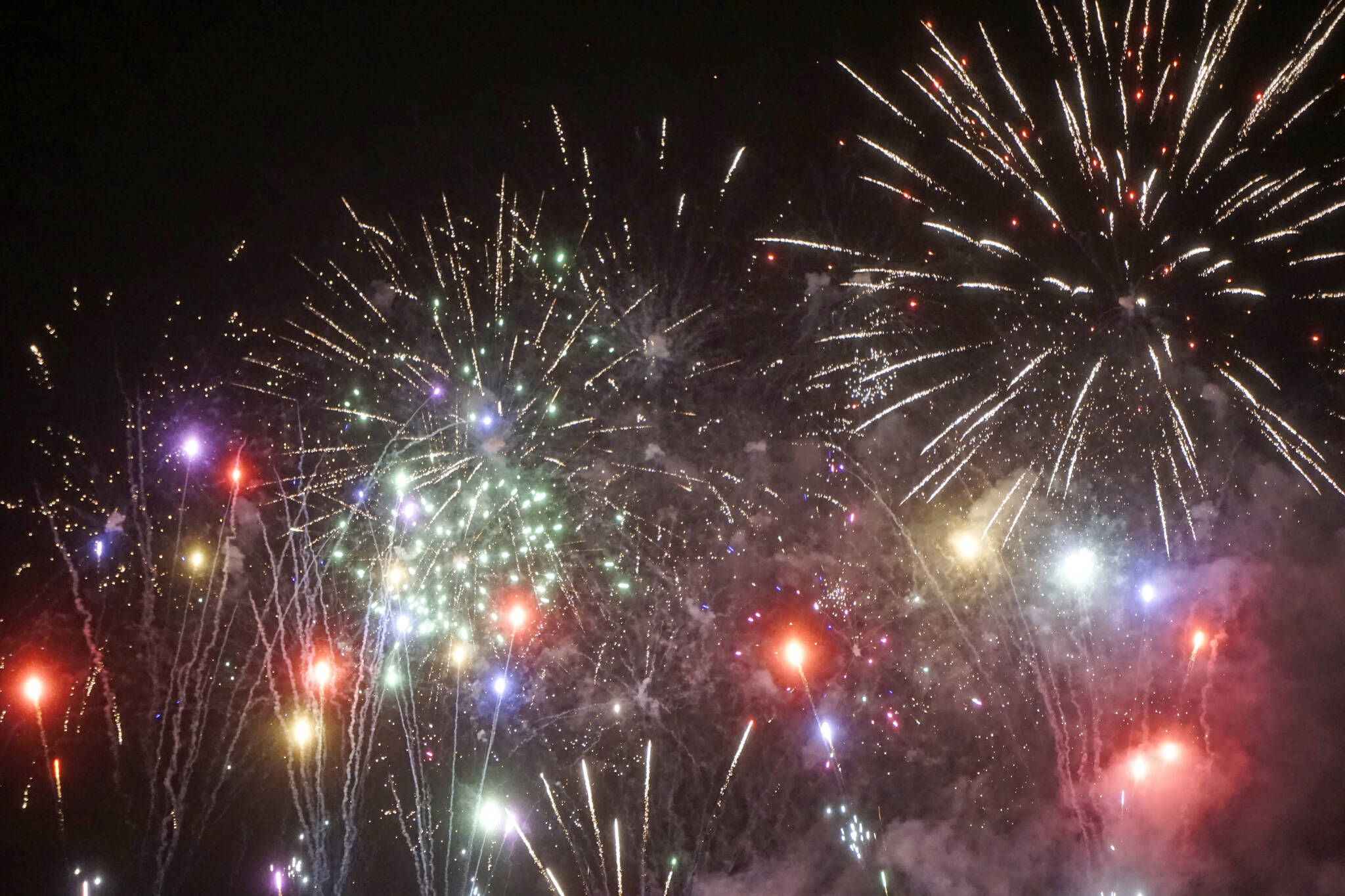 Fireworks explode for the fourth annual Fireworks Fantastical on New Year's Eve, Dec. 31, 2021, over Mariner Park in Homer, Alaska. (Photo by Michael Armstrong/Homer News)