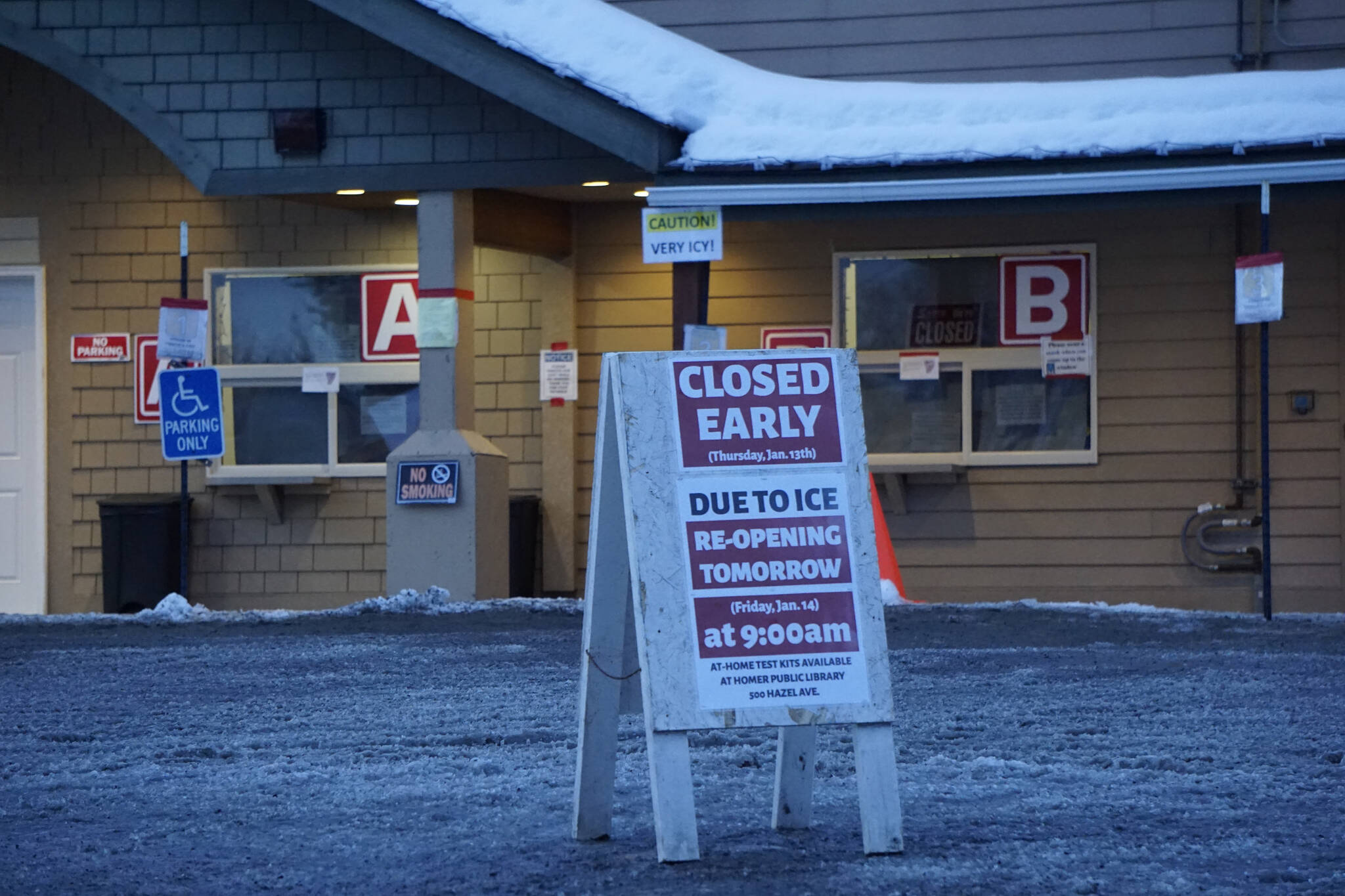 Photo by Michael Armstrong/Homer News
A sign warns of icy conditions in the parking lot of the Bartlett Street COVID-19 vaccine and testing clinic on Thursday, Jan. 13, in Homer. The clinic closed early that day to de-ice the lot.