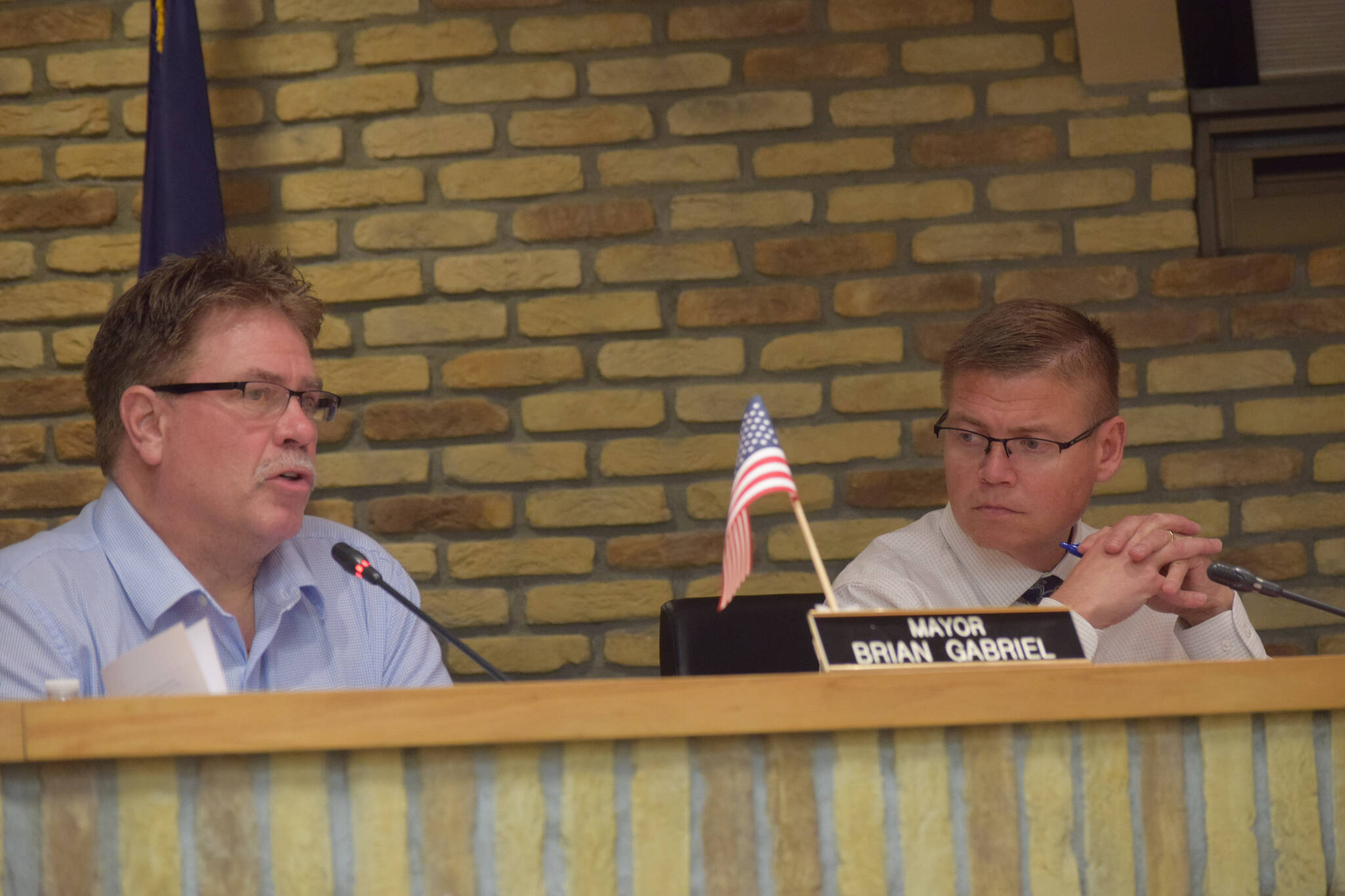 Kenai Mayor Brian Gabriel and Kenai City Manager Paul Ostrander speak at the Kenai City Council meeting on Wednesday, Jan. 19, 2022. (Camille Botello/Peninsula Clarion)