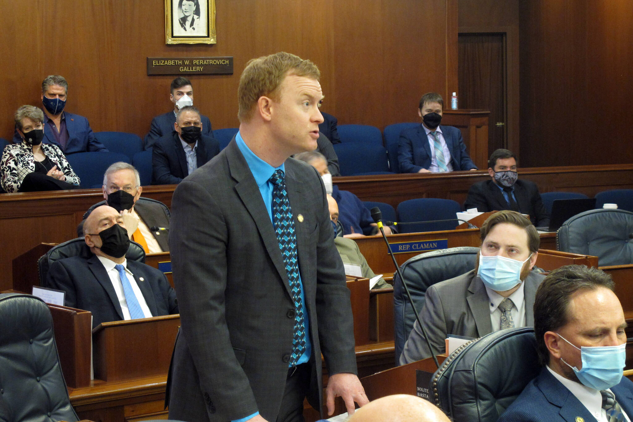 Alaska Republican state Rep. David Eastman, standing, speaks on the House floor on Friday, Feb. 4, 2022, in Juneau Alaska. Alaska House leaders have backed away from a proposal to strip committee assignments from Eastman, who has acknowledged being a member of the far-right organization Oath Keepers, and for now plan to hold at least one hearing on the group. (AP Photo/Becky Bohrer)