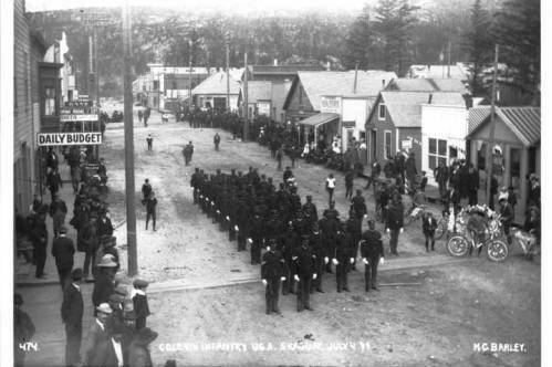 Black soldiers of Company L, 24th Infantry, famously known as "Buffalo Soldiers," parade on 5th Avenue in Skagway, between Broadway and State streets, in front of the Daily Budget newspaper on July 4, 1899. A recent book from a University of Alaska Anchorage history professor traces the long history of Black Americans in Alaska. (Courtesy image / Alaska's Digital Archives)