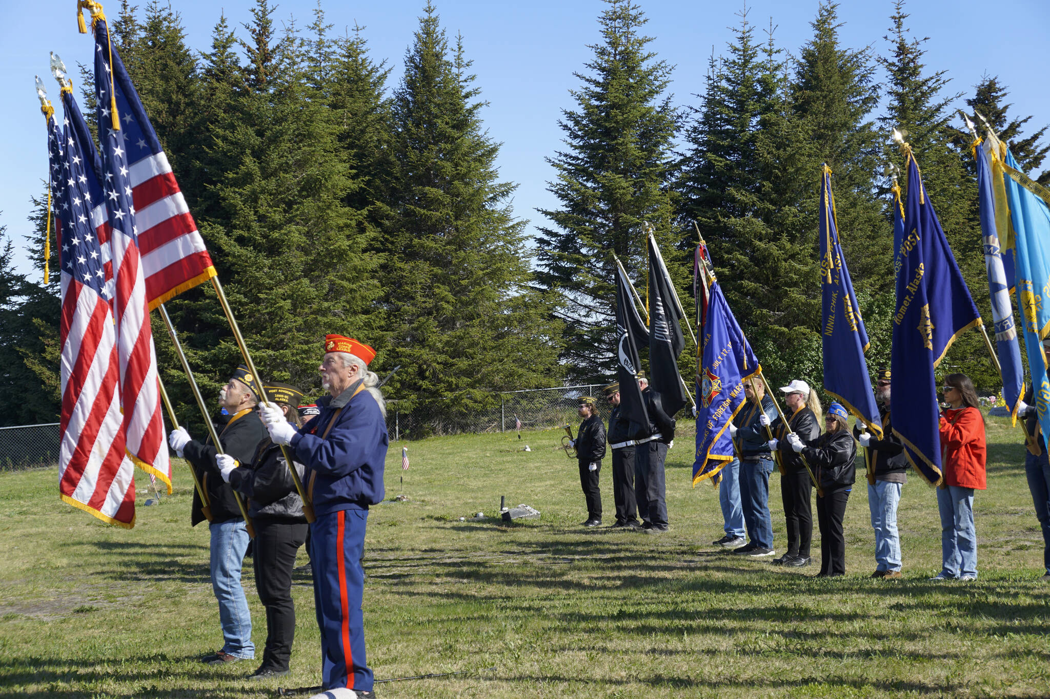 An honor guard consisting of members of the Marine Corps League, American Legion Post 16, Homer, and Veterans of Foreign Wars Post 10221, Anchor Point, hoist flags at Memorial Day Ceremonies on Monday, May 30, 2022, at Hickerson Memorial Cemetery near Homer, Alaska. (Photo by Michael Armstrong/Homer News)