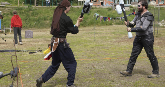 En garde!

Liam "Scrimgar" James, left, and Neill "Bogeyman" Roderick face off in a duel for Ice Fire Bay, Homer's Live Action Role Play group, on Saturday, July 2, 2022, at Karen Hornaday Park in Homer, Alaska. Ice Fire Bay has met every Saturday throughout the COVID-19 pandemic, including outdoors in the winter.
Ice Fire Bay holds a weekend of LARP Friday, July 22, through Sunday, July 24, 2022 at Karen Hornaday Park. The $45 fee includes games, a Magic: The Gathering tournament, a quest at the park, a campsite for two nights, two breakfasts and two dinners, and a banquet meal. Registration is at 3 p.m. Friday. For more information, call 907-399-3035.
(Photo by Michael Armstrong/Homer News)
