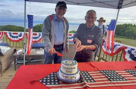 The Rotary Club of Homer-Kachemak Bay celebrated the accomplishments of one Rotary year and looked ahead to a new year at a social gathering July 1. Honored were Kim Zook, left, newly installed president of the club, and Bernie Griffard, immediate past president. At back is Marv Peters, a charter member of the club and one of the club’s directors.