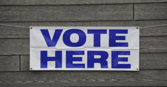 A banner at Homer City Hall identifies the building as a voting precinct. Early voting runs at city hall from 8 a.m. to 5 p.m. today, Friday and Monday in Homer, Alaska. (Photo by Michael Armstrong/Homer News)