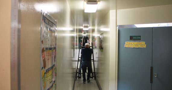 Staff move tables ahead of lunchtime at Soldotna Elementary School on Friday, Sept. 30, 2022, in Soldotna, Alaska. (Ashlyn O’Hara/Peninsula Clarion)