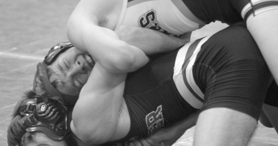 Soldotna’s Jacob Strausbaugh tries to turn Palmer’s Kael Salisbury during the 112-pound final at the Lancer Smith Memorial wrestling tournament Saturday, in Wasilla. (Photo by Jeremiah Bartz/Frontiersman)