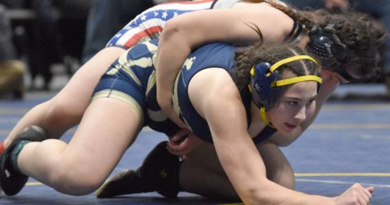 Homer's Roane Cook defeats North Pole's Lylah Murrah for the Girls state title at 185 pounds Saturday, Dec. 18, 2022, at the state wrestling tournament at the Alaska Airlines Center in Anchorage, Alaska. (Photo by Jeff Helminiak/Peninsula Clarion)