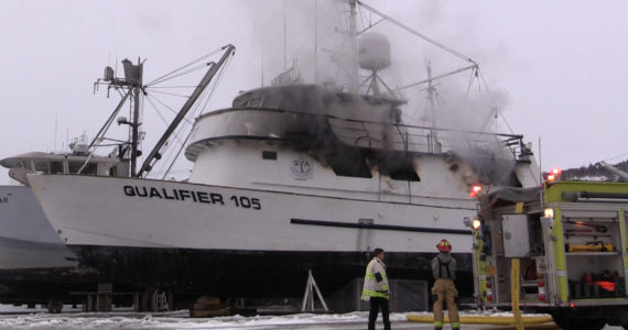 Emergency personnel respond to a fire on R/V Qualifier, in the Northern Enterprises Boatyard on Kachemak Drive, Jan. 19, 2023, in Homer, Alaska. (Photos by Nika Wolfe)