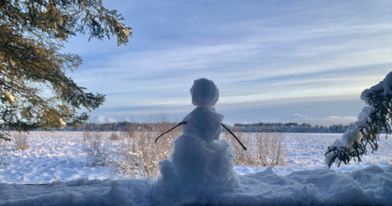 A tiny snowman looks out over Beluga Slough from the Calvin and Coyle trail, Jan. 21, 2023, in Homer, Alaska. (Photo by Christina Whiting)