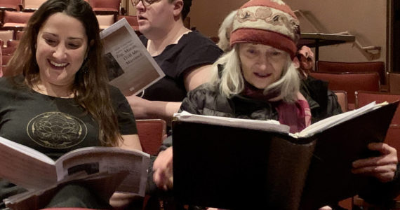 Photo by Christina Whiting/Homer News
Jessica Hahn (left front), Sunrise Sjoberg (right front) and Carolyn Norton rehearse during a weekly community chorus at the Mariner Theater on Feb. 21 .