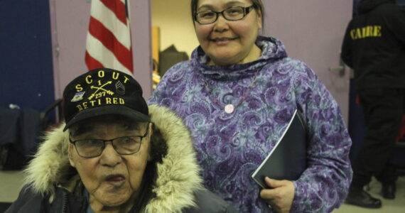 AP Photo/Mark Thiessen
This March 28, 2023, photo shows Bruce Boolowon, left, posing with his eldest daughter, Rhona Pani Apassingok, at an Alaska National Guard ceremony in Gambell, Alaska. Maj. Gen. Torrence Saxe, the adjutant general of the Alaska National Guard, presented Alaska Heroism Medals to Boolowon, the last surviving guardsman of 16 who helped rescue 11 Navy crewmen after they crash landed on St. Lawrence Island on June 22, 1955, and to the family members of 15 other guardsman who are now deceased.