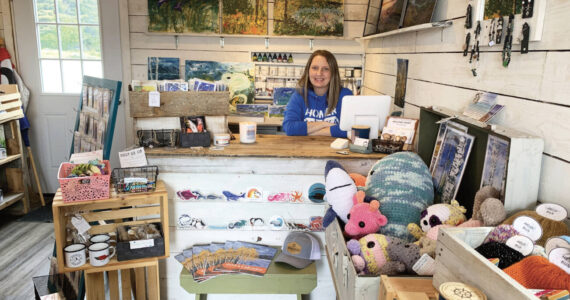 Homer artist and owner of 59 North Creations, Tracy Hansen, is photographed in July 2023 in her shop at the base of the Homer Spit in Homer, Alaska. Photo by Christina Whiting