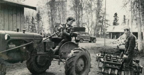 Rusty Lancashire backs up the family tractor so her husband Larry can connect it to the disc for their fields. (1954 photo by Bob and Ira Spring for Better Homes & Garden magazine)