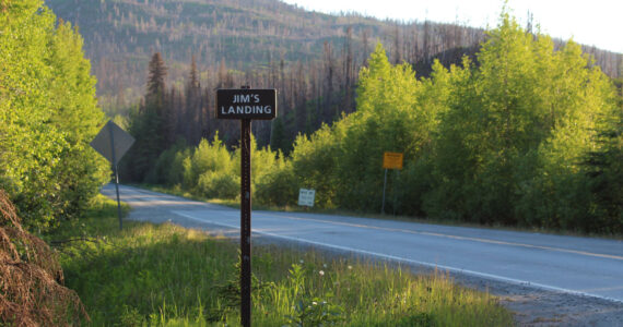 A sign indicates the turn for Jim’s Landing on Skilak Lake Road on Sunday, June 13, 2021, near Skilak Lake on the Kenai Peninsula in Alaska. (Ashlyn O’Hara/Peninsula Clarion)