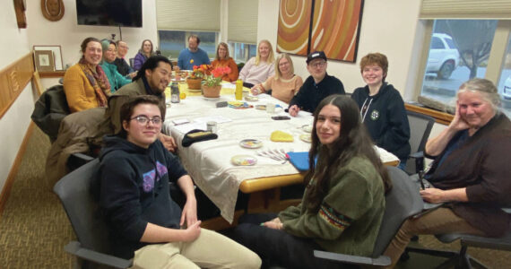 Emilie Springer/ Homer News
Ashe Dias, left front, and Sofia Loboy, right front, hold a community meeting to share their goal of creating an event calendar and resource guide for community youth.