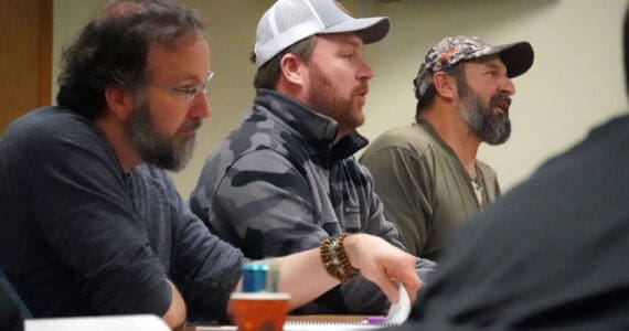 Cook Inlet Coordinator for the Department of Fish and Game Matt Miller and Kenai/Soldotna Fish and Game Advisory Committee Members Greg Springer and Monte Roberts discuss proposals to the the State Board of Fisheries at a committee meeting at Cook Inlet Aquaculture Association in Kenai, Alaska, on Monday, Jan. 15, 2024. (Jake Dye/Peninsula Clarion)