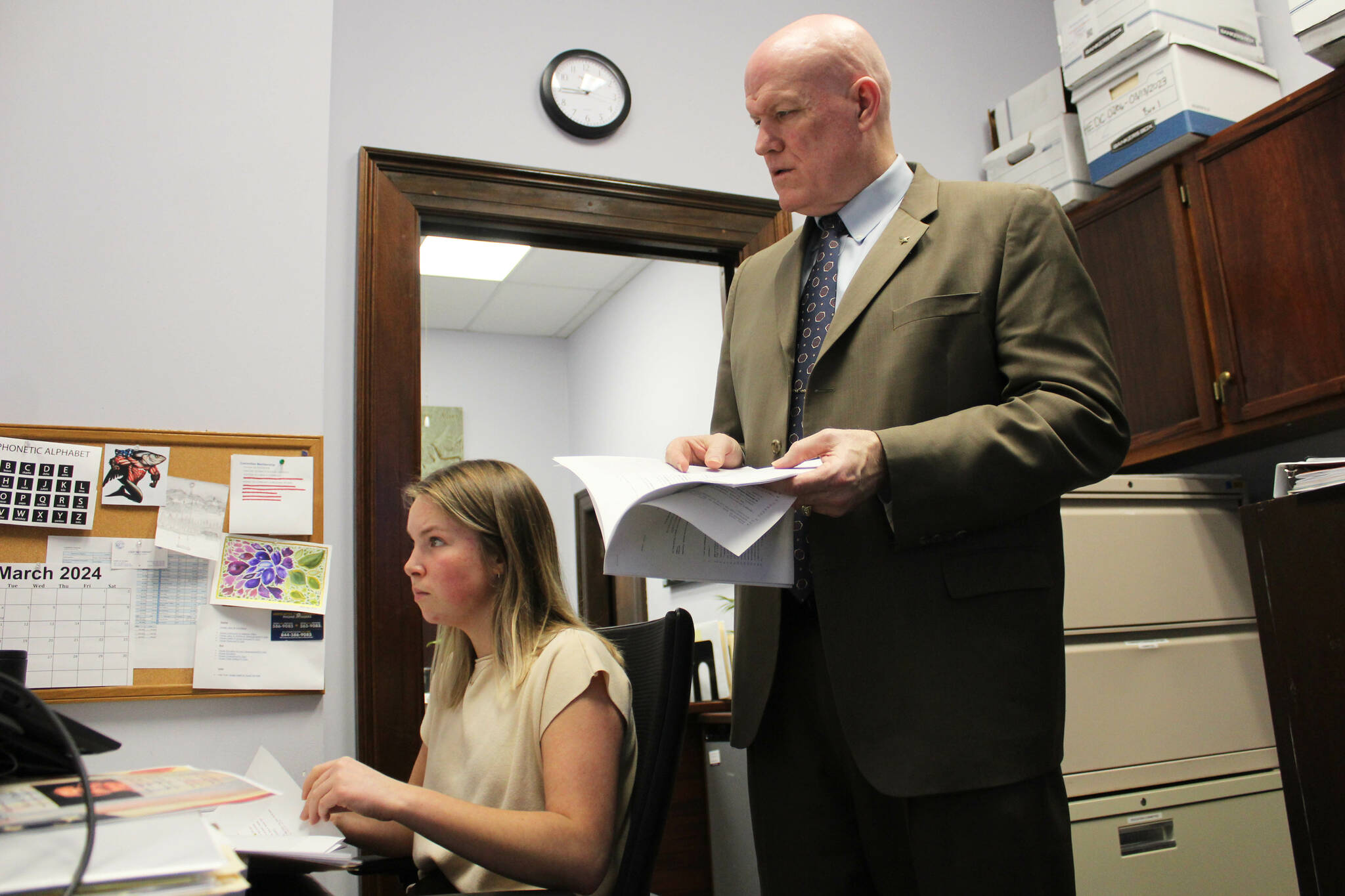 Bud Sexton, chief of staff for Alaska House Rep. Justin Ruffridge, and aide Sabina Braun, left, review amendment language in their office at the Alaska State Capitol building on Wednesday, March 6, 2024 in Juneau, Alaska. (Ashlyn O’Hara/Peninsula Clarion)