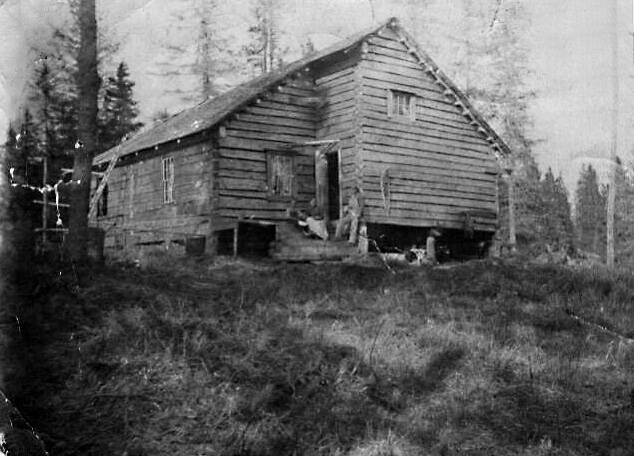 What are almost certainly members of the Grönroos family pose in front of their Anchor Point home in this undated photograph courtesy of William Wade Carroll. The cabin was built in about 1903-04 just north of the mouth of the Anchor River.