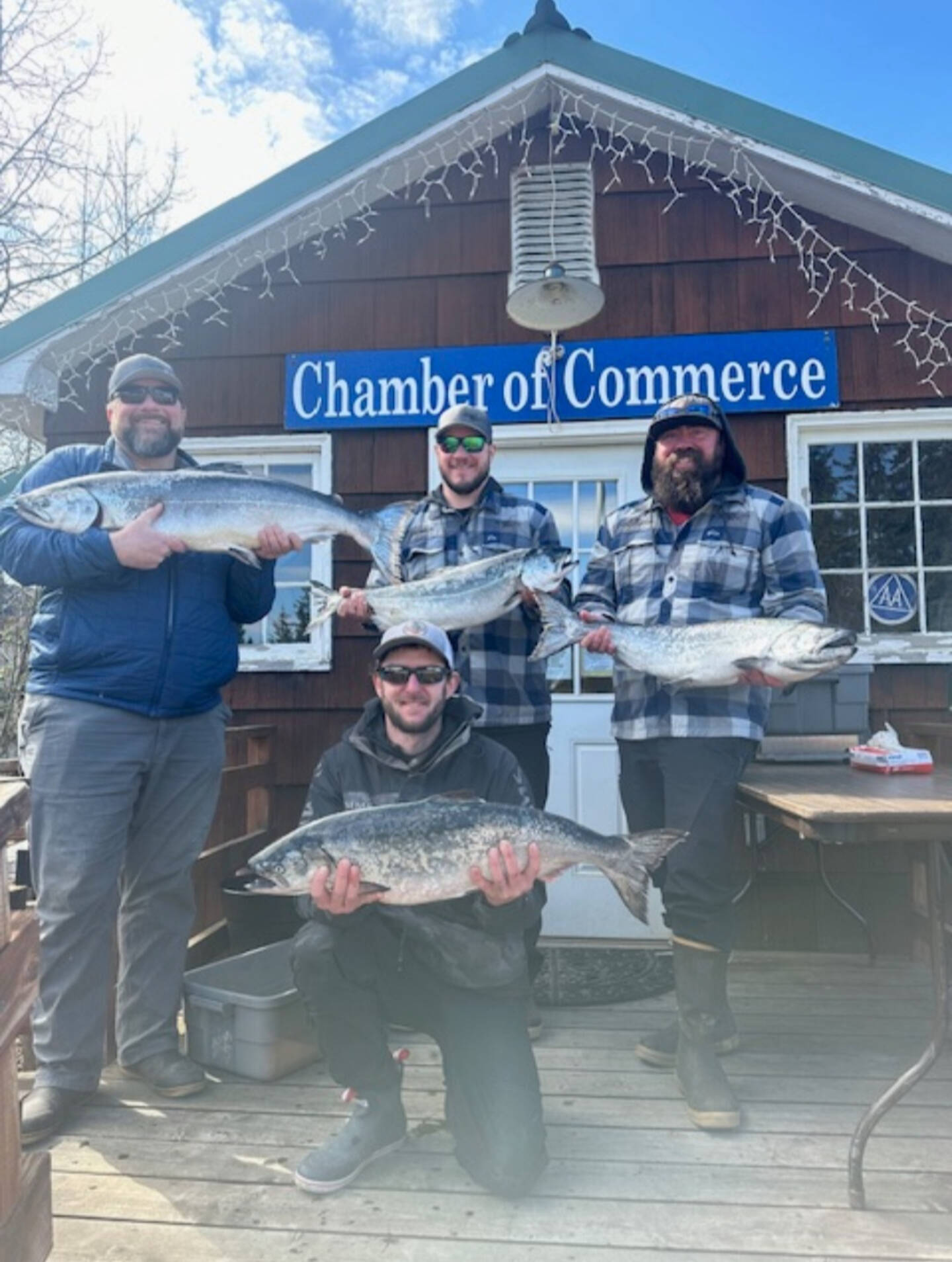 Arthur Schwartz, Matt Denn, Keith Herring and Jesse Pasch pose with their winning catches in front of the Anchor Point Chamber of Commerce building on Saturday, April 27, 2024 in Anchor Point, Alaska. All four anglers fished on the Resolute and earned various prizes from the 29th annual Anchor Point King Salmon Derby. (Photo provided by Erin Jerde )