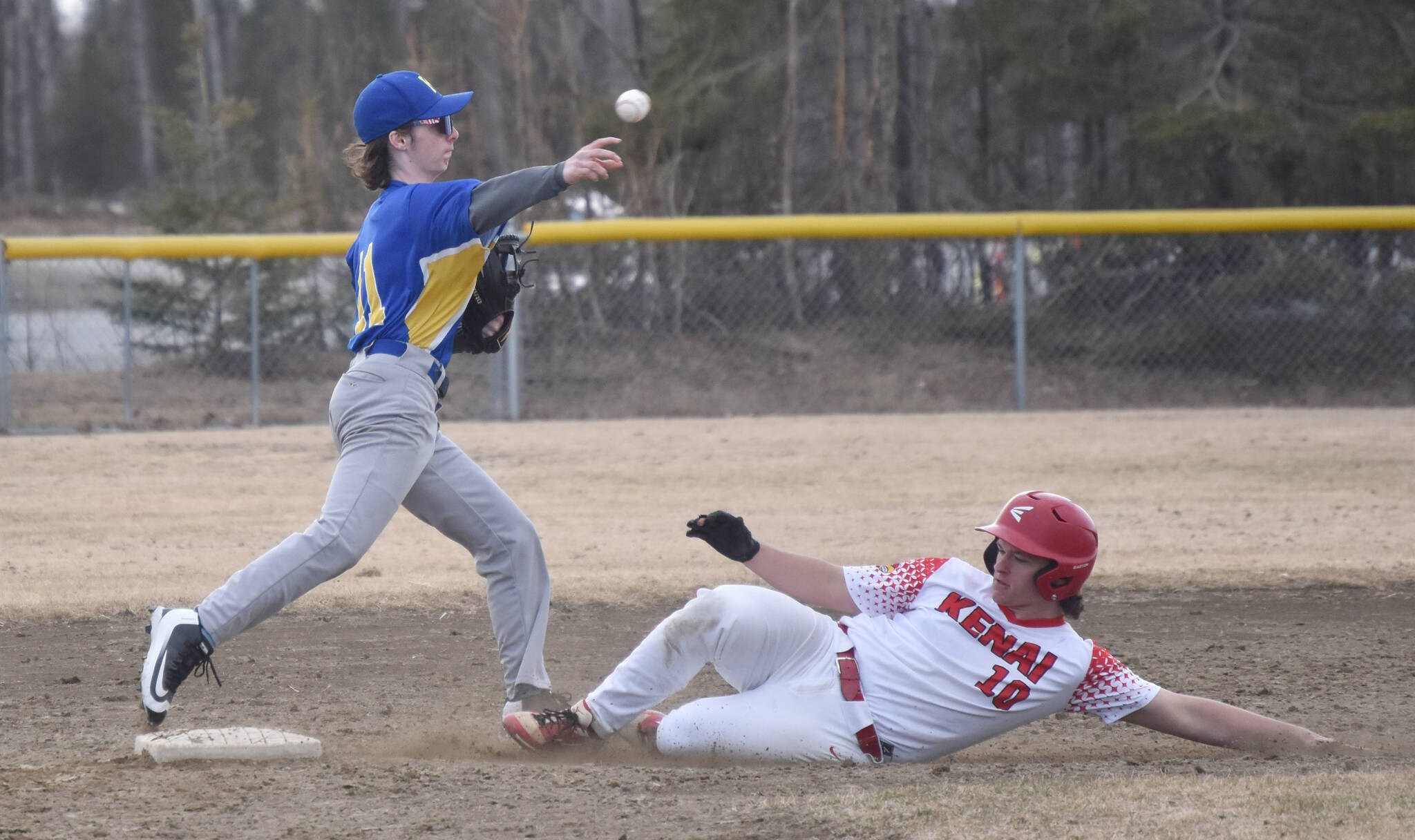 Kodiak’s Ejler Durand forces out Kenai Central’s Gabe Smith on Friday, April 26, 2024, at the Soldotna Little League fields in Soldotna, Alaska. (Photo by Jeff Helminiak/Peninsula Clarion)