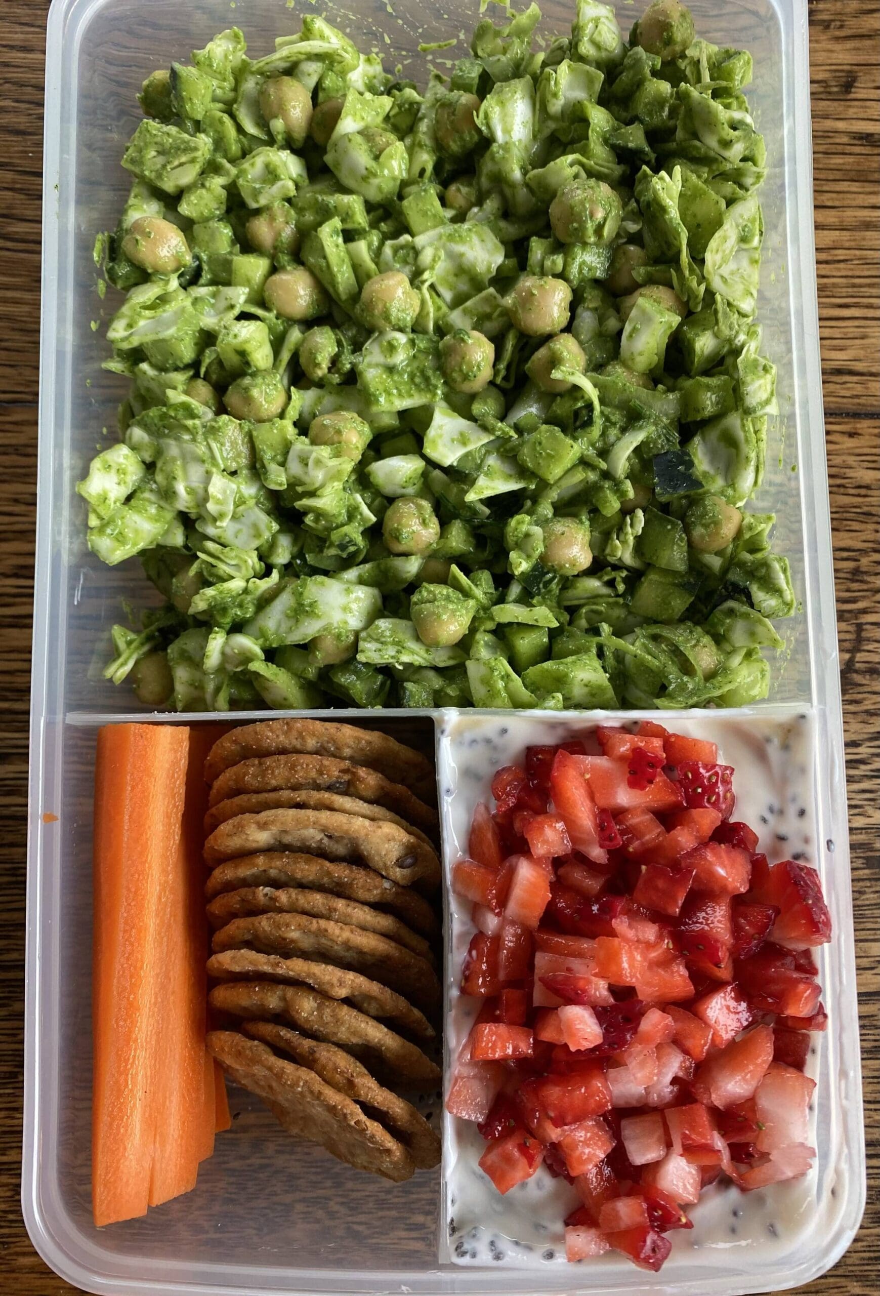 Green goddess salad is served with cookies, carrots and fresh strawberries. (Photo by Tressa Dale/Peninsula Clarion)