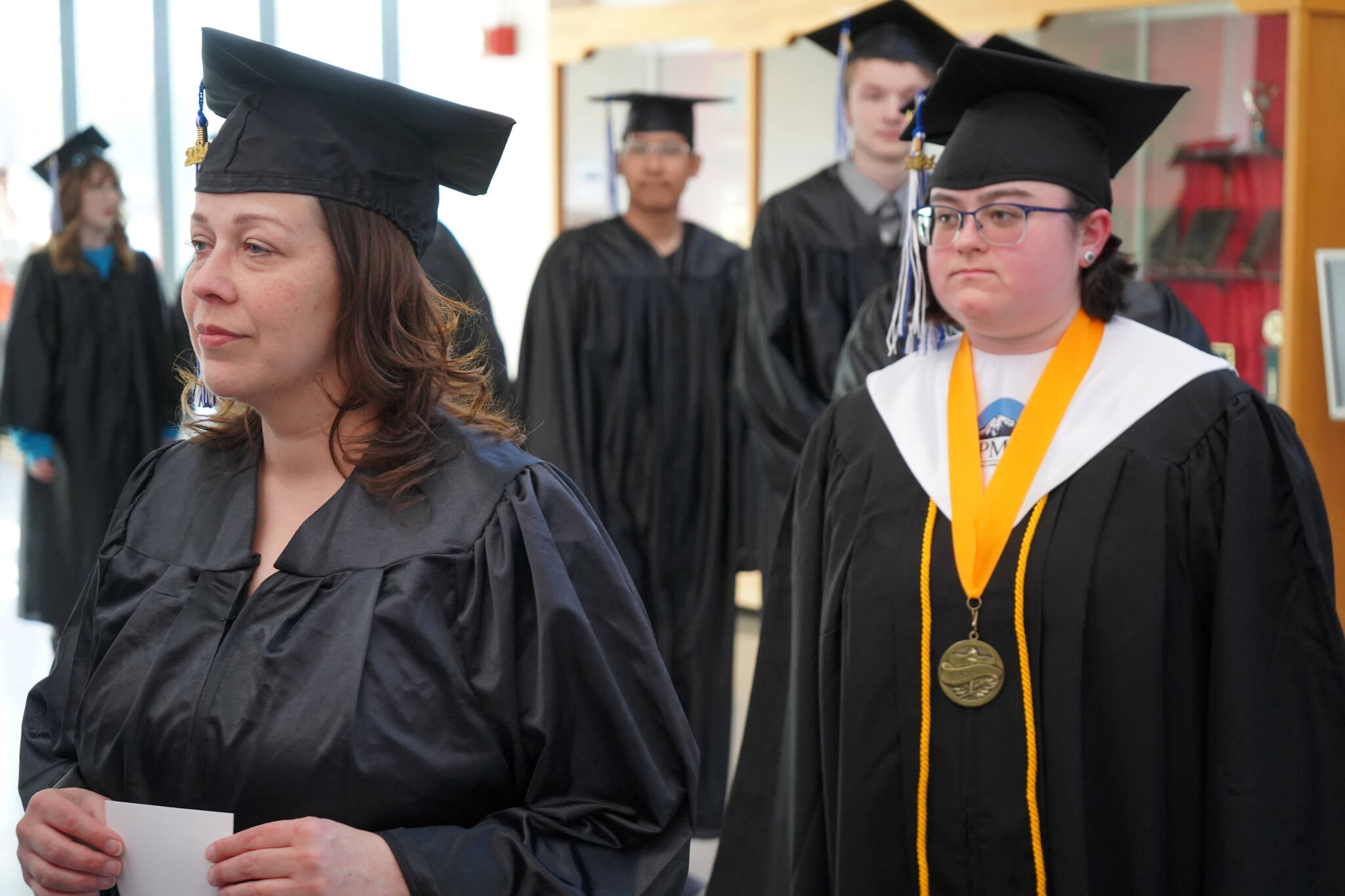 Graduates of Kenai Peninsula College proceed into the 54th Annual Kenai Peninsula College Commencement Ceremony at Kenai Central High School in Kenai, Alaska, on Thursday, May 9, 2024. (Jake Dye/Peninsula Clarion)