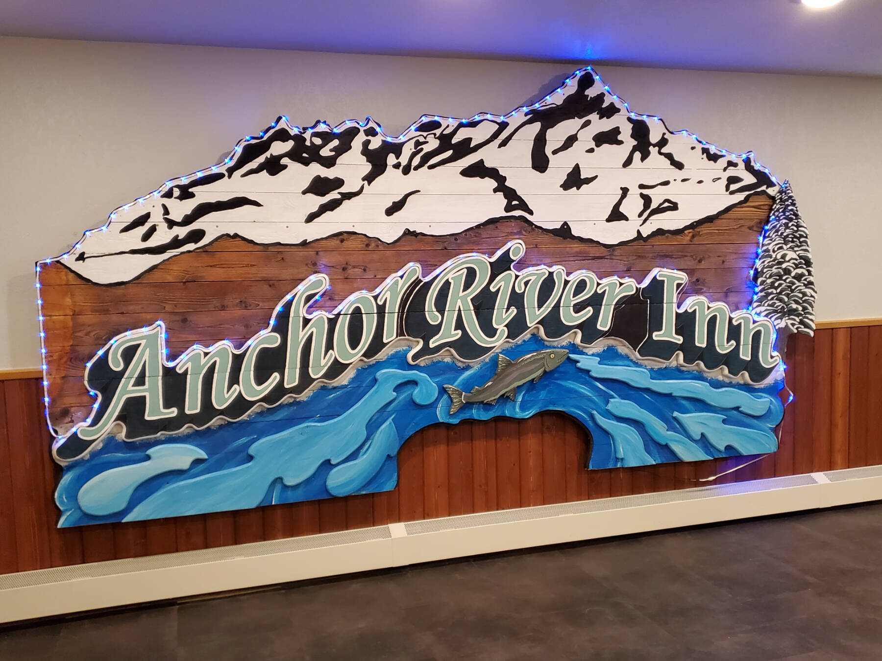 The old Anchor River Inn sign, photographed on Saturday, May 11 2024, is on display as historic art in the Angry Salmon restaurant in Anchor Point, Alaska. (Delcenia Cosman/Homer News)