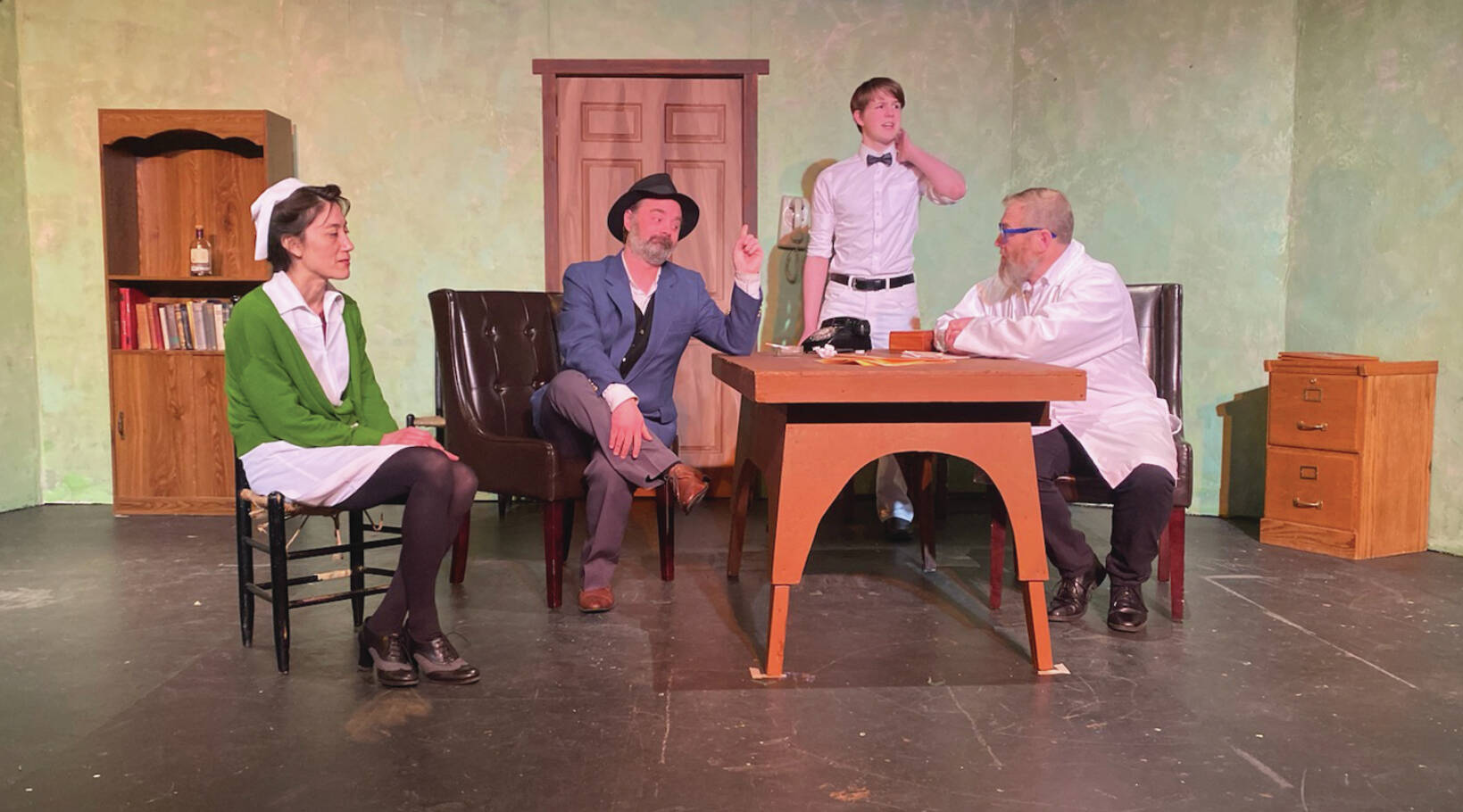 Crane Jackinsky as Nurse Kelly; Tyler Munns as Elwood P. Dowd; Dayus Anthony as Wilson; and Mike Tupper as Dr. Sanderson rehears a scene from Harvey on Monday at Pier One Theatre. Photo provided by Val Sheppard.